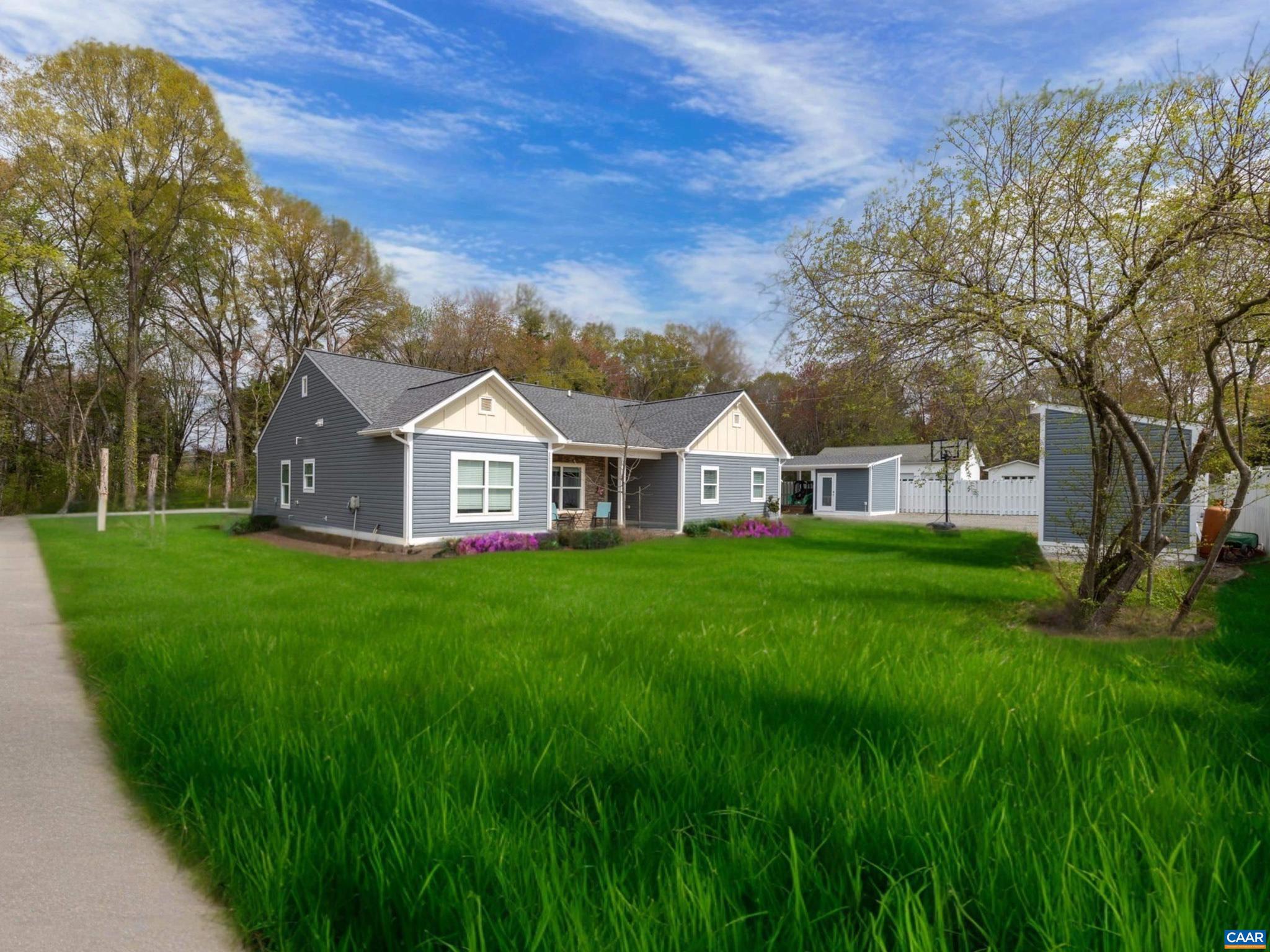 Welcome to this beautifully crafted Ranch-style home designed with comfort & functionality in mind. This gem offers the convenience of single-level living & features ceramic tile flooring throughout, offering both durability & style. The open-concept layout flows seamlessly, perfect for modern living & entertaining. The spacious kitchen features stainless steel appliances & plenty of cabinets & granite countertop space. The attached 2-car garage is currently being used as a home gym, entertainment & living space, giving you the convenience of a workout space right at home. Added bonuses in this home are the EcoSmart tankless water heater & the radon mitigation system. Step outside to find the perfect setting for gatherings?a spacious patio with a covered sitting area complete with a beautiful wood-burning fireplace & television, ideal for cozy evenings under the stars. Two storage sheds (both with elec) & additional covered storage offers extra room for tools, gear, or seasonal items, keeping everything organized. Whether you're hosting friends or enjoying a quiet night in, this home offers the perfect blend of comfort, function, and modern appeal. Book your tour today!,Granite Counter,Wood Cabinets,Fireplace in Living Room