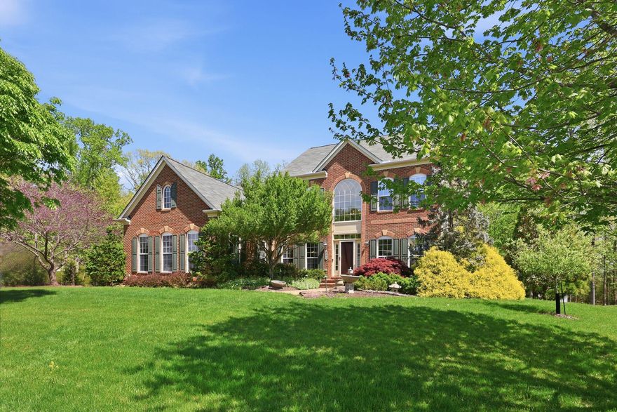 Rarely available Brookside model with a main-level owner’s suite, set on a private .59-acre lot backing to trees. Designed for both everyday living and entertaining, this home offers exceptional outdoor space with an oversized hot tub, exterior gas fireplace, and a 3-season room just off the kitchen—perfect for relaxing year-round.
The main level features a spacious owner’s suite along with a private office, formal dining room, and a light-filled two-story living room anchored by a stunning stone gas fireplace. The kitchen is spacious with tons of cabinet storage, a large island, and overlooks the backyard—keeping you connected to both indoor and outdoor living.
Upstairs, you’ll find three additional bedrooms and a full bathroom. The finished lower level is ideal for entertaining, complete with a large rec room, full bar, full bathroom, and an additional flex room perfect for a bedroom, office, or hobby space.
The seller is a professional landscaper, and it shows—the exterior is beautifully maintained with thoughtful design and standout curb appeal.  
Life in the Brookside Reserve section is unmatched, with wide streets, estate treed lots, and amazing community amenities including seven miles of scenic walking trails, two community pools, tennis and basketball courts, stocked fishing ponds, and playgrounds—all within walking distance. Just minutes away, Vint Hill offers breweries, wineries, coffee shops, fitness studios, and more.