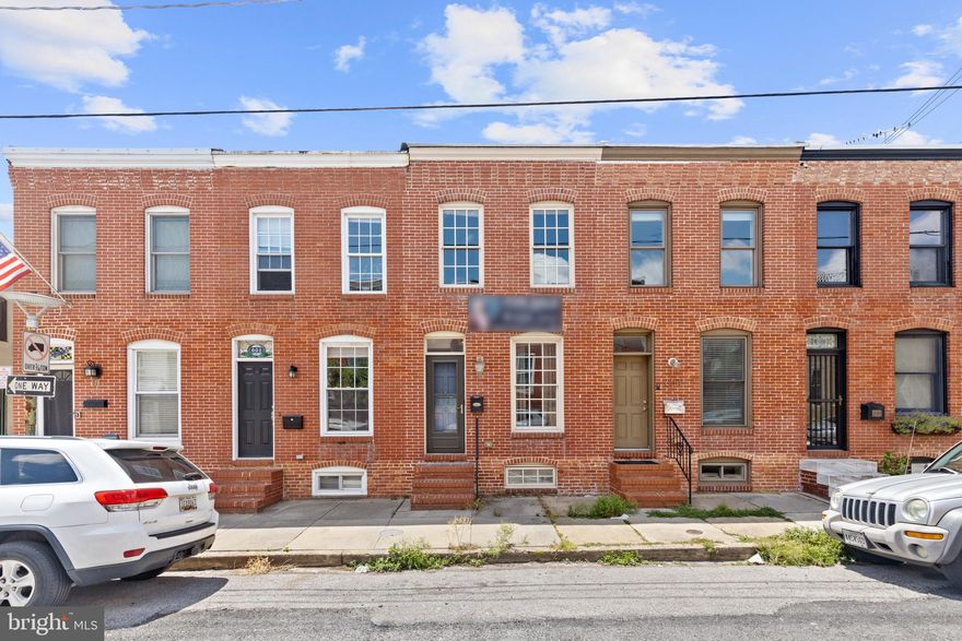 Maryland's local brokerage proudly presents 606 S Bouldin St Baltimore MD 21224. Walk into this stunningly fresh Canton home with the iconic exposed brick that runs through the primary level. The kitchen offers a large island to entertain, granite counters, and plenty of storage space. Running to the posterior of the property is the outside access to your parking pad. Walk upstairs to find two large bedrooms, two large bathrooms, and access to the rooftop deck. From 2020-2023, the existing owner updated both bathrooms, flooring and fresh paint throughout, and added in the iconic rooftop deck. This property is move in ready, schedule your showing today!