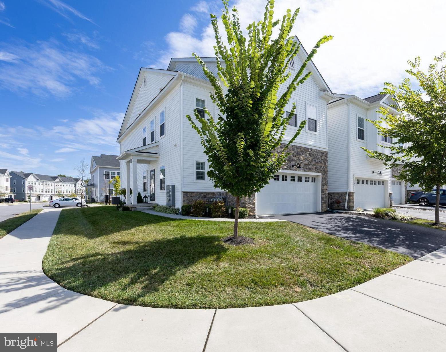 Don’t miss this fantastic opportunity to own an impressive end-unit Carriage Home in the highly desirable Lochiel Farm community—offering direct access to the Chester Valley Trail and the 727-acre Exton Park! This 2664 sf ft home has been meticulously maintained and is in pristine condition. Step inside to a bright open layout with hardwood floors on the main level. The gourmet kitchen is a showpiece, featuring an oversized circular granite island, abundant soft-close cabinetry, stainless steel appliances with gas range and vented hood, tile backsplash, and custom under-cabinet lighting with a full spectrum of color options. A walk-in pantry adds excellent storage. The adjoining dining area flows seamlessly into the great room with a gas fireplace and sliding glass doors to the trex deck—perfect for relaxing or entertaining. A powder room and access to the 2-car garage completes the main level. Upstairs, an open loft area provides flexible space for an office, playroom, or lounge. The primary suite impresses with two walk-in closets, recessed lighting, and a spa-like bath with double granite vanity and frameless glass shower. A cozy sitting nook is ideal for reading or a personal work space. Two additional bedrooms, one with a walk-in closet, a hall bath, and a convenient laundry room complete this level. The full basement with high ceilings, egress window, and generous footprint is ready to be finished into a custom recreation or media room. Upgraded light fixtures, custom window treatments and 9’ ceilings on all 3 levels enhance the home’s modern feel. Enjoy this prime location just steps from the 19-mile Chester Valley Trail for walking, running, and biking. The adjoining 727-acre Exton Park offers a wide array of amenities, including a dog park, disc golf course, playground, sand volley ball court, and scenic walking trails. Lochiel Farm also provides easy access to shopping, dining, Exton train station, and major roadways—making this home as convenient as it is beautiful. Located within the award-winning West Chester Area School District!
