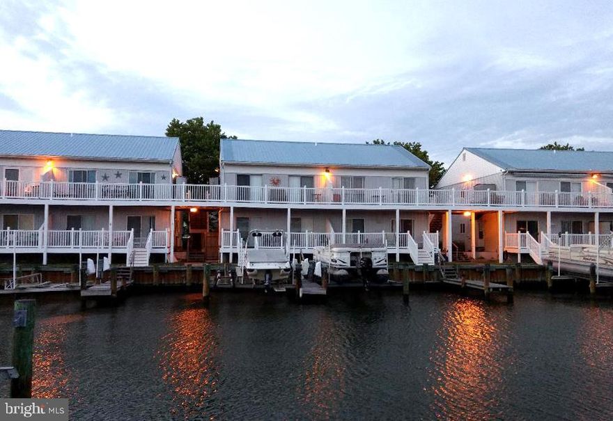 Lovely 3 bedroom 2 bath with southern exposure overlooking wide canal. Includes boat slip with 10,000 # lift for boat AND jet skis. Sold fully furnished. Excellent condition in and out. Short walk to the beach. Two storage sheds. Modest condo fees.