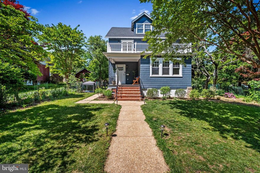 Welcome to 5724 Ridgedale Road — a stunning restoration in the heart of Mount Washington that balances the home’s historic character with all the conveniences of modern living. Nestled on an idyllic, low-traffic street, this rare gem offers upgraded systems, exceptional craftsmanship, and versatile living across four finished levels.

Beautifully restored original hardwood floors run throughout the home, complemented by solid wood doors and original hardware that honors the home's history. The main level features a welcoming living room anchored by a wood-burning fireplace, a formal dining room, and a flexible room perfect for an office, den, or media space. The fully renovated chef’s kitchen is designed for both everyday living and entertaining, featuring quartz countertops, soft-close cabinetry, stainless steel appliances, a Thor commercial-style 36” six-burner gas range with exterior venting hood, oversized island seating, and massive walk-in pantry.

A convenient main-level primary suite offers ample space, two large closets, and a luxurious en-suite bath. An adjacent main-level bedroom and full bath provide ideal flexibility for guests, office space, or additional living needs.

Upstairs, gleaming hardwood floors lead to a second spacious primary suite complete with a walk-in closet and marble-finished en-suite bath. Two additional bedrooms, a full hall bath, and access to the front balcony complete the second level. The balcony overlooks a gorgeous mature crepe myrtle, creating the perfect setting for relaxing, entertaining, or enjoying the sunrise with a cup of coffee.

One floor up, the finished third floor loft offers a versatile space that functions beautifully as a 6th bedroom, playroom, den, etc.

The finished lower level, accessible from both the interior and exterior, features an open-concept layout, a full bath, a dedicated laundry room, and abundant storage--providing an ideal opportunity for guest quarters or rental income.

Outside, the flat, fenced yard is professionally landscaped with all native and pollinator plants and provides a green space perfect for pets, gardening, entertaining, or recreation. The detached two-car garage includes an electric vehicle charging port.

Major upgrades include new HVAC systems with dual-zone heating and cooling, new ductwork, updated plumbing and electrical with 200-amp service, new roof and seamless gutters, , new industrial-grade TPO roofing on the rooftop deck, and new aluminum fencing — all completed with permits in 2024.

This rare turnkey home offers complete serenity just minutes from the Village of Mount Washington, local dining, Whole Foods, Starbucks, houses of worship, and the light rail station with free commuter parking.