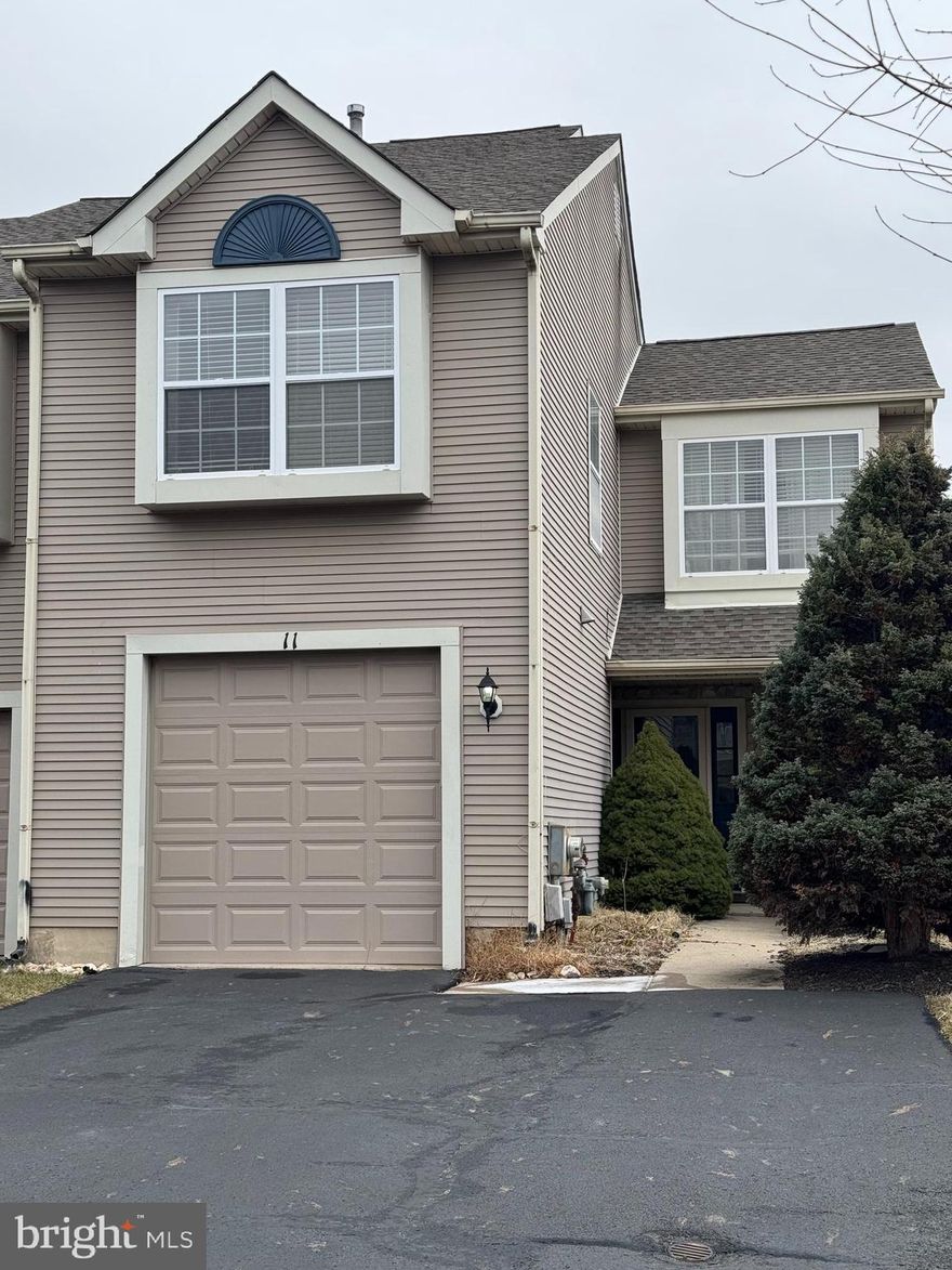 Wonderful end unit in the Heather Wood section of the highly sought after Newtown Grant community in beautiful Bucks County. Enter through the covered porch into the foyer which flows into the great room with souring cathedral ceiling and sky lights bring in an abundance of natural light. The separate dining area features a gorgeous double french doors leading to a private brick patio. The kitchen offers gas cooking, built-in microwave, dishwasher and upgraded countertops. Completing this level is a powder room, laundry room and inside access to the 1 car garage. The second level is an open concept with a bright and cheery loft with a double window seat. The primary bedroom with walk-in closet, en suite bath with shower stall and tub. There is a nice size second bedroom with offers plenty of closet space. A separate full hall bath with tub/shower and linen closet. This is a very bright and sunny home with light filtering in from front to back. Conveniently located with easy access to I-95, NYC and Princeton with regional rail service. There is an abundance of shops, dining options, parks, walking and biking trails. Award winning Council Rock School District.