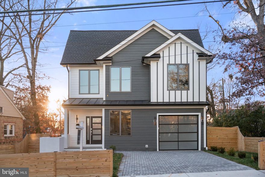 Experience modern luxury at its finest in this striking new construction by KB Custom Homes, perfectly positioned at the “Top of the Hill” in Arlington. With sweeping neighborhood views and an unbeatable location just minutes from the Pentagon, Amazon HQ2, Shirlington, and DCA, this new built 2025  delivers both elevated design and everyday convenience in one exceptional package.

Offering 3,570  square feet of beautifully finished living space, this 5-bedroom, 4 full bath bath residence is a true showcase of craftsmanship and contemporary sophistication. Every detail has been thoughtfully curated, from hardwood flooring throughout all three levels to the dramatic 10-ft ceilings on the main level, 9-ft ceilings upstairs, and 9-ft ceilings in the fully finished  walkout basement, creating volume, light, and an airy sense of scale.

At the heart of the home, the European custom-designed kitchen is both stunning and functional, featuring KitchenAid appliances, sleek modern cabinetry, and refined finishes designed to inspire everyday cooking and elevated entertaining alike. The open-concept layout seamlessly connects the living, dining, and kitchen areas, while the dining space opens directly to a trex deck, delivering the ultimate indoor-outdoor living experience. dedicated office (which can easily be converted into a bedroom) and a full bath complete the main level.

Throughout the home, luxury design elements elevate every space, including engineered hardwood on all three floors, oversized doors, an electric fireplaces, and wood-paneled accent walls with integrated light channels that add warmth.

All bathrooms exude spa-level elegance with distinct floating vanities and ceramic tiles imported from Spain, Italy, and Portugal, blending global craftsmanship with modern design. The main-level flexible room offers the perfect option for a home office or guest suite.

The upper level is designed as a true retreat. A loft provides a complimentary living space, ideal for family mornings or reading lounge, The primary suite feels like a private sanctuary, featuring a spa-inspired bath with a double shower, dual custom vanity, and a custom-designed walk-in closet thoughtfully built for both style and function.

Two additional generously sized bedrooms share this level, along with a convenient laundry room, making everyday living effortless and perfectly organized.

While the bright, expansive lower level with a wet bar and recreation area is ideal for entertaining.

Step outside and enjoy one of Arlington’s most dynamic locations, just moments from the vibrant dining and boutique scene of Shirlington, with effortless access to parks, trails, cultural attractions, and major commuter routes, minutes to Pentagon city and -15 minutes to Georgetown and DC., Minutes to DCA   and Amazon HQ, the pentagon this location places opportunity and lifestyle at your doorstep.