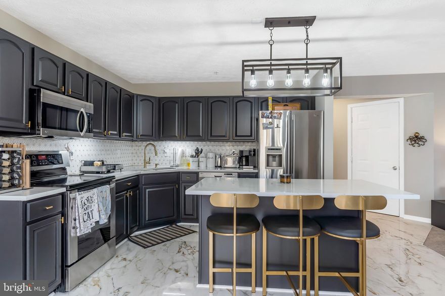 Magnificent updated home with large deck and 2 car garage set high up in a beautiful residential neighborhood. Full of modern day features with classic accents, you will find fresh paint, new light fixtures, and new window treatments, carpeting and flooring throughout this bright and spacious open floor plan. The main level is flooded in sunlight throughout the day and reflects across the hardwood flooring in the welcoming spacious living room into the dining room with classic chair railing molding, modern chandelier and two large windows with views of the backyard. The bright remodeled eat-in kitchen has gleaming porcelain tiled flooring, quartz countertops, backsplash, stainless steel appliances, large island, modern light fixture and gold accents.  The kitchen opens up to the cozy family room with new carpeting, and a newly re-tiled center wall gas fireplace. Also on this level is a half bath with a new vanity and mirror. The Primary’s Suite upstairs has a remote controlled ceiling fan, new walk-in closet system, and ensuite bath with double vanity, large soaking tub and shower. There are 3 additional roomy bedrooms with large closets, and a full bathroom.  The lower level is unfinished and is ready to make your own with a finished half bath and laundry.  Out the kitchen’s sliding glass doors enjoy warm weather barbecues and relaxing on your deck in the peaceful setting.  A New Roof was installed in 2020, and the HVAC System and Hot Water Heater were replaced 2022! Close to parks, dining, shopping, and a short drive to Waldorf, Crofton, Bowie, and DC. Schedule your tour today!