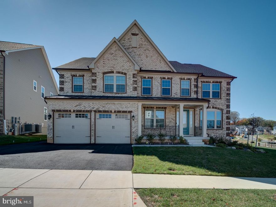 Discover this beautiful, elegant home tucked away in the heart of Ellicott City, Maryland. From the moment you enter, you are welcomed by a dramatic floating staircase and sun filled open spaces. The main level features a spacious Living Room, formal Dining Room and a private office... ideal for today's lifestyle.The gourmet chef's Kitchen boasts of stainless steel double oven, dishwasher, and cooktop,a massive center island granite,  quartz counter tops,  butlers pantry and an inviting layout that flows into the Family Room with floor to ceiling fireplace. The luxurious primary Suite  impresses with a sitting area, dual walk-in closets ,and a door that opens to the bathroom complete with floating vanity and double sinks, a frameless glass shower door and a stand alone soaking tub. Generously sized four secondary bedrooms each include private baths, perfect for comfort and privacy. The fully finished lower level provides exceptional entertainment space —with a wet bar and an incredible tiered media room, designed for the ultimate movie theater, with a walk-out backyard. Whether hosting blockbuster nights, game-day parties, or cozy family evenings, this entertainment space makes every gathering unforgettable. One bonus rooms and one additional full baths provide even more flexibility for a gym, playroom, or guest suites. Outside, enjoy a lush backyard , with a newly stamped concrete patio-$50,000 .This is more than a home; it's a lifestyle opportunity.