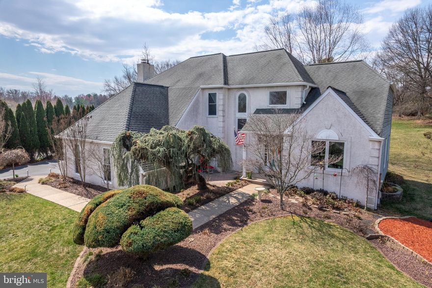 Welcome to this Elegant Home nestled in the highly sought-after Council Rock School District. This stunning four-bedroom, two-and-a-half-bathroom home sits on the largest lot in the neighborhood at 1.37 acres—while also benefiting from the lowest taxes in the area!
A beautifully landscaped walkway leads to the inviting entrance, complete with a charming private brick patio and covered entryway. Step in to this TurnKey home to a grand double foyer, where a versatile craft room sits to the right—ideal for a home office, playroom, or creative space. Just beyond, the warm and inviting living room offers plenty of space to unwind and features a newly installed patio door leading to a composite deck—a perfect spot for enjoying your morning coffee or tea.
The formal dining room, currently serving as an office, provides generous space and flexibility to suit your needs. Continuing down the hall, you'll find a beautifully updated powder room and a spacious laundry room with ample storage. From the laundry room, step into the attached two-car garage, complete with brand-new garage doors.
At the heart of the home lies the updated eat-in kitchen, featuring stone countertops, a double oven, a glass cooktop, and New stainless-steel appliances. New pendant lighting adds a stylish touch, while crown molding and recessed lighting enhance the space. The kitchen seamlessly flows into the inviting family room, which continues the elegant details with additional crown molding, recessed lighting, and a  fireplace.
Just off the kitchen, step outside onto a breathtaking wraparound deck, complete with a charming pergola—ideal for entertaining or unwinding in the serene, tree-lined backyard. This home offers ultimate privacy, with a lush row of mature arborvitaes creating a natural barrier, ensuring seclusion for the home.
Upstairs, the spacious master suite is a true retreat, featuring two large walk-in closets and a beautifully updated en-suite bathroom. Indulge in spa-like amenities, including a soaking tub, glass-enclosed shower, double vanity, and exquisite stone countertops. Just outside the bathroom, a built-in vanity with a luxurious marble top adds both elegance and convenience. Step onto the private balcony off the master suite and take in breathtaking views of the expansive backyard—your own personal oasis. A great place to unwind and view the sunsets.
On the opposite side of the home, a hallway leads to three additional bedrooms, each offering generous closet space and abundant natural light. The hall bathroom has been beautifully updated, featuring a double vanity with elegant stone countertops, a large glass-enclosed shower, and a stylish barn door.
Adding even more living space, the fully finished 1400 sq ft. basement provides limitless potential. Whether you envision a home gym, media room, game room, or entertainment space, this expansive lower level is ready to accommodate your vision.
This home is equipped with a newer heating and cooling system, installed in November 2018. A new heat pump and oil burner were added, and the system has been serviced annually, ensuring top performance and efficiency.
This Turnkey home is filled with premium upgrades, including: A finished basement, brand-new driveway,  New garage doors, New recessed lighting throughout, All-new windows for enhanced efficiency & style, Beautifully updated bathrooms, Secluded outdoor spaces with a private porch, balcony, and patio, and so much more!
With its expansive lot, luxurious features, finished basement, and unbeatable location in the award-winning Council Rock School District, this home is truly a rare gem.
Don't miss your chance to own this incredible home—schedule your private showing today!