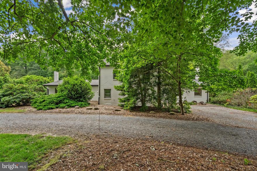 Welcome to your dream home! Nestled in a serene and tranquil neighborhood and situated on one private acre, the main custom-built contemporary home offers the perfect blend of luxury, comfort and sophistication.  Boasting 3 spacious bedrooms, 2.5 bathrooms and 2,490 square feet of living space, this stunning residence is an oasis of tranquility and modern elegance….plus there is an additional fully equipped 1,500 square foot studio apartment with a kitchen, bedroom, living room, full bath, workshop and one car garage for a total of 3,990 of fabulous living space! As you step inside the main home, you will be greeted by an inviting open concept floor plan, perfect for large scale entertaining or relaxing with loved ones. The living room with a wood burning stove flows seamlessly into the great room, complete with cathedral ceilings, a gas stove fireplace, skylights and handmade custom bookcases (may not convey), creating an airy atmosphere enhanced by an abundance of natural light. Prepare to be amazed by the gourmet kitchen, complete with handmade cabinets created by the seller, black appliances, Terrazzo tile, skylights and gas cooking. Separate dining room/library with recessed lights and tile floor. Retreat to your main level luxurious primary suite featuring recessed lighting, wood burning stove with masonry chimney, sitting area, large walk-in closet and en-suite bathroom offering a spa-like experience. Continue up the spiral staircase to 2 additional bedrooms and 1 full bath. Step out the sliding glass doors from the great room or kitchen to experience the true essence of this remarkable property and discover your own private oasis. A spacious (10x70) deck awaits your outdoor gatherings or peaceful relaxation.  This private retreat is a nature lovers paradise backing to wooded parkland and combines the benefits of a quiet suburban setting with convenient access to amenities, schools, parks, and transportation. Don’t miss out on this unique opportunity to own your own piece of paradise, call me today for your private tour!