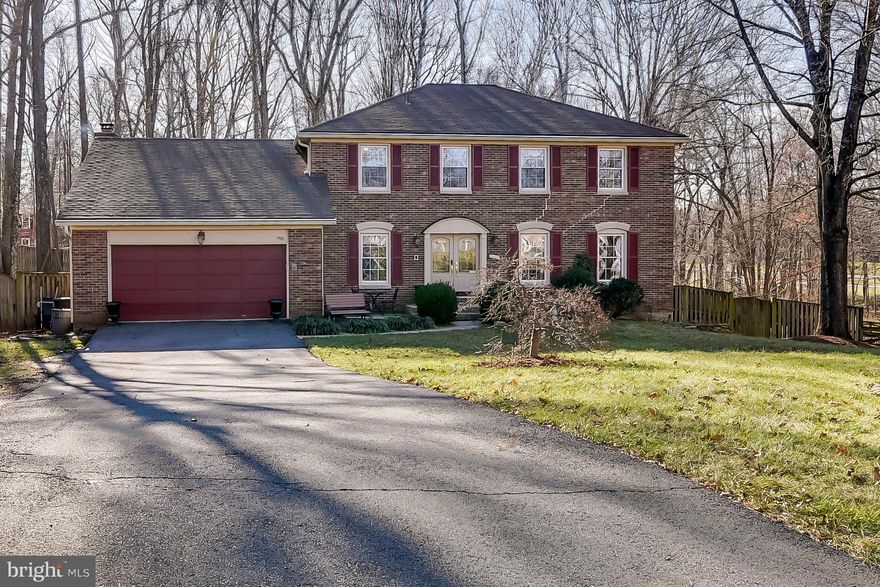 This is a well maintained  6 bedroom , 3 1/2 bath home in a very desirable  community/school location at an affordable price! Other houses list well over $600,000 in the same neighborhood, this is your chance to put your finishing touches on this beauty! You might have lost all hope that you would find a private, large fenced-in back yard with mature trees, where pets and children can safely run and play while you watch the deer go by...custom built visually pleasing playground equipment will transfer with property! As one of the largest yards in the neighborhood, this lot will make your spacious yard dreams a reality. When walking into the double front doors you will notice the home office with custom built ins overlooking the front yard, which conveniently enables you to work from home while watching for packages and visitors. Also connected to the foyer is a spacious second sitting room/formal living room that opens into the dining room, making the flow of entertainment effortless. A large powder room, in a well designed, middle of the main floor location welcomes your family and guest. A well maintained kitchen overlooks your show stopper backyard and has an open floor plan which is connected to the family room and eat-in kitchen. Family room has a centered wood burning fireplace that would beckon holiday and winter nostalgia from any scrooge. Head down the stairs to your private basement haven.  A space you could consider sharing with your in-laws and visitors, enabling them to enjoy a private living quarters equipped with a full size bedroom, bathroom and spacious living room. Would also be a perfectly designed large playroom and nanny live in space! The possibilities are endless! Basement has normal ceiling heights and lots of natural light. Double basement doors lead out onto a small patio where you once again find yourself in the glorious back yard. Basement living room leads into meticulously maintained workshop where you have ample space to keep your tools and crafts. Plumbing and hot water heater are clean and rust free. They have been under service warranties for more than 90% of the life of this home. House already has natural gas! You will notice a lot of comparable houses do not yet have natural gas...the cost to run those lines can be many thousands! Community has pools, tennis courts and walking trails for a very reasonable $71 per month!House is priced competitively as sellers recognize updates are needed to carpet and paint. Sellers have already obtained estimates to do carpet and paint and they have taken the cost of those things into consideration and priced the home accordingly. New carpeting has been priced at $5,000, increasing the area of wood floors in main living space has been priced at $3,500. Painting of the ENTIRE house, is priced at $6,500. Estimates and contractor information is available upon request. Front of house has some cracks in brick from settling. This has been repaired and looked at by a structural engineer. Letter from engineer and further details is provided in listing documents. Work is warrantied through 2031. No further adjustments are needed.