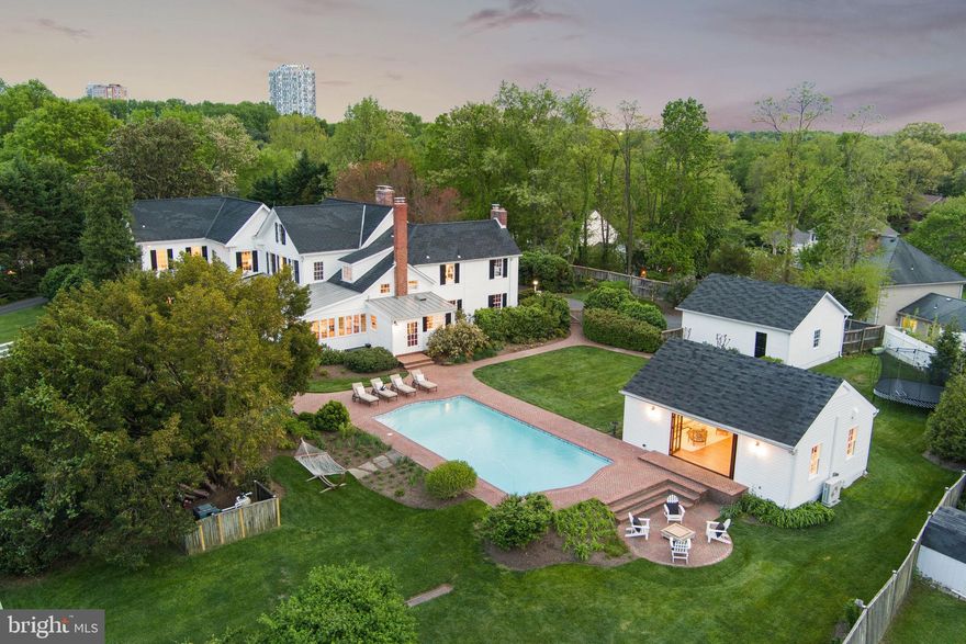 Nestled in the trees, perched atop a hill, sits Rocky Run Farm, a private oasis located five minutes from Tysons Corner. The property, updated with a recent $400k renovation, retains its historic farmhouse style, while exuding charm and character. Situated on 1.3 elevated acres, it offers unparalleled privacy while located within the established neighborhood of McLean Estates. Boasting a two-car detached garage, a pool, pool house, outdoor dining area and outdoor fire pit, it's an ideal setting for leisurely afternoons and entertaining guests.

The two story main house and detached pool house total almost 6,300 square feet of luxury living with six bedrooms, plus an office/study and six wood-burning fireplaces. Five of these bedrooms are situated upstairs, including the primary retreat that boasts a deck overlooking the expansive grassy and lushly landscaped backyard which centers around the swimming pool. The home's main level consists of a large and versatile guest bedroom suite along with a formal dining room, formal living room, family room wrapped in original mid-century pecky cypress wood, library with built-ins and a powder room. The fully outfitted custom-designed gourmet kitchen offers a Wolf and Sub-Zero appliance package, two dishwashers, a huge center island, custom cabinetry, an adjacent breakfast room, mud room and screened in porch. The recently renovated pool house has a fully-retractable NanaWall that embraces indoor/outdoor living, as well as a legal full kitchen and laundry. 

This remarkable estate offers a rich history. The original farm house is believed to have been built by Colonel George West Gunnell prior to 1860, and it still stands today as part of the main house. The property's legacy unfolds through decades, from an expansive tobacco farm as part of over 1,000 acres to a 130-acre equestrian property often visited by the Kennedys. Stories intertwine with legends, such as alleged encounters between JFK and Marilyn Monroe within its walls, lending an air of mystique to its history. Today, this exceptional estate stands as a testament to timeless elegance with all the modern amenities one would expect from a newly constructed modern-day home.

Located on a quiet street less than a mile from the Silver Line Metro/Tysons, within the esteemed Spring Hill/Cooper/Langley High School pyramid, Rocky Run Farm provides easy access to premier shopping, dining, and entertainment destinations. Its proximity to major commuter routes like the Dulles Toll Road (entrance is 0.5 miles away), the beltway, and the GW Parkway ensures convenient access to the entire D.C. region.