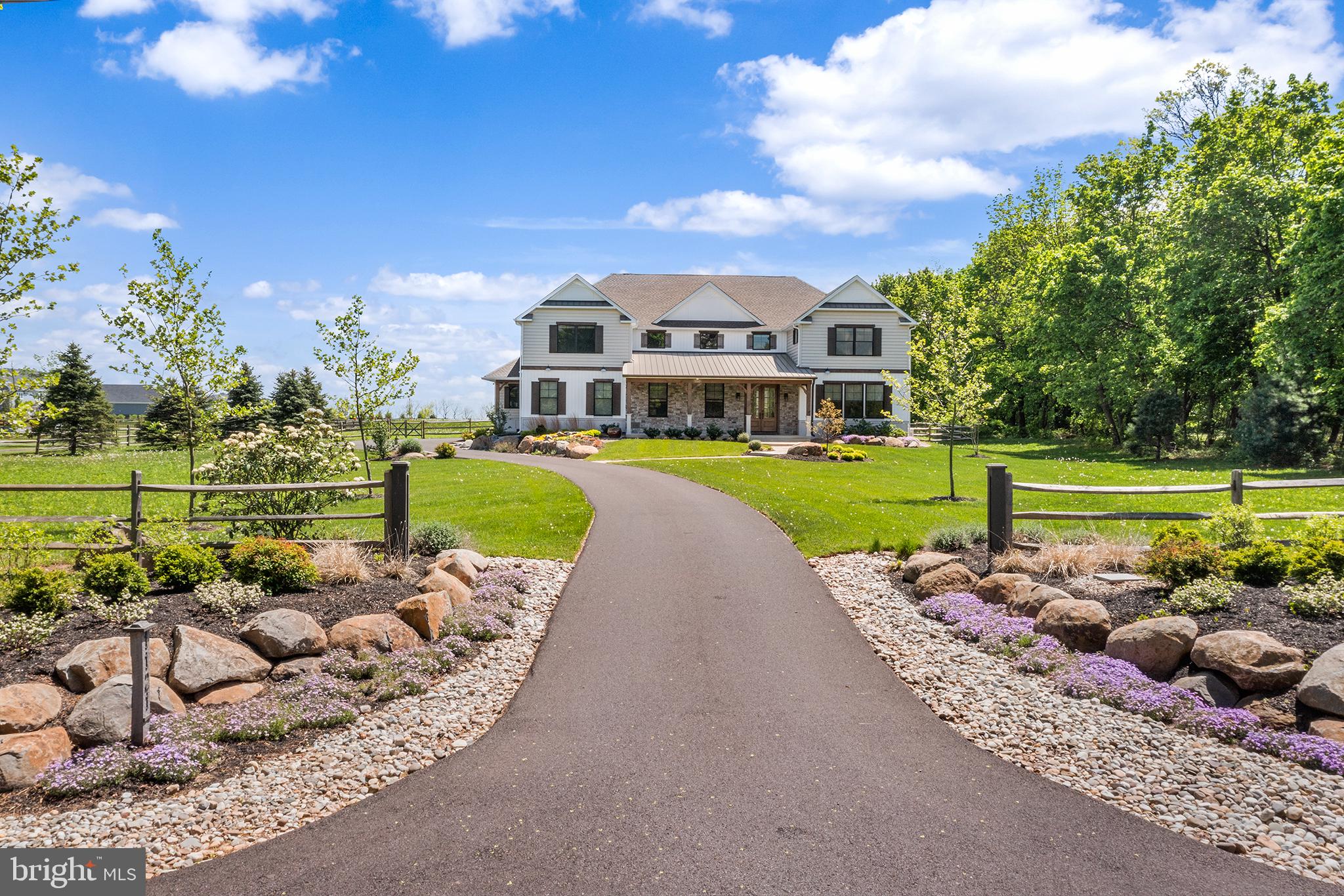 Nearly new Custom Model Home for Sale. You can have new construction now!
A rare opportunity to own a 5 bedroom custom-built modern farmhouse in one of Bucks County’s most exclusive locations in the Vineyard at Peace Valley community. Located walking distance to Lake Galena offering quiet every day living, with easy access to major roadways, shopping, local restaurants, parks, and the highly sought-after Central Bucks School District. Beautiful fenced in back yard.
Enjoy walking, kayaking, boating, biking, hiking and picnicking at Peace Valley Park and Lake Galena.
This custom 5-bedroom modern farmhouse is on a beautiful 1.88-acre lot. This home is full of high end custom finishes with high-quality craftsmanship and attention to detail. You will enjoy sitting on your covered front porch featuring elegant timber columns, a grand entrance with double knotty alder solid wood doors, and a blend of siding and stone. Listen to the tranquil sound of the water feature while you enjoy the beautiful extensive front landscaping. The rear deck features a pergola and expanded paver patio for everyday relaxing or indoor/outdoor entertaining.
Inside is a grand two story foyer with views through wide-open floor plan with 10’ ceilings and 8’ solid core doors throughout. The Gourmet Chef's Kitchen is the heart of the home with a large island, high end Cafe Appliance Package, open to the two-story grand 20 x 21’ dining area and great room with walls of glass to capture the views of the scentic back yard from every angle. Two huge walk-in pantries featuring custom built in wood shelving for ultimate storage and organization. The house has incredible custom millwork and built-ins throughout, with the signature craftsmanship and design that Casadonti Homes is known for. The main level, features en suite bedroom suite with an additional bonus room that can be utilized as a living room, flex space, 2nd office, playroom. The large Mudroom with built-in cabinetry provides a separate family entrance with tons of storage space or area for pets. The second floor featurins an Owner’s Suite complete with three closets, each with custom wood shelving. The Owner’s Suite Bathroom offers features a free-standing soaking tub, large double bowl vanity, walk-in shower with custom tile details, and linen closet. Three additional large bedrooms with spacious closets, all featuring custom shelving, provide comfortable living spaces. An hall bath with designer vanity and tile details and a huge laundry room with cabinetry complete the second floor. This remarkable home offers five bedrooms, two bonus/flex spaces, and 3.5 baths, with open gathering areas and private office and bedroom suite and flexibility to suit your needs. This home features an oversized three-car garage and full basement with high ceilings ready to be finished. There is an Option for the Builder to add an additional full bathroom on the second floor if Buyer chooses. Buyer can select layout and design. This is a limited opportunity to own a nearly new luxury custom home in The Vineyards at Peace Valley Winery built by Casadonti Homes. Enjoy the best of both worlds with quite country living, with modern amenities and conveniences walking distance from Lake Galena and just minutes from downtown Doylestown.. This house has it all!