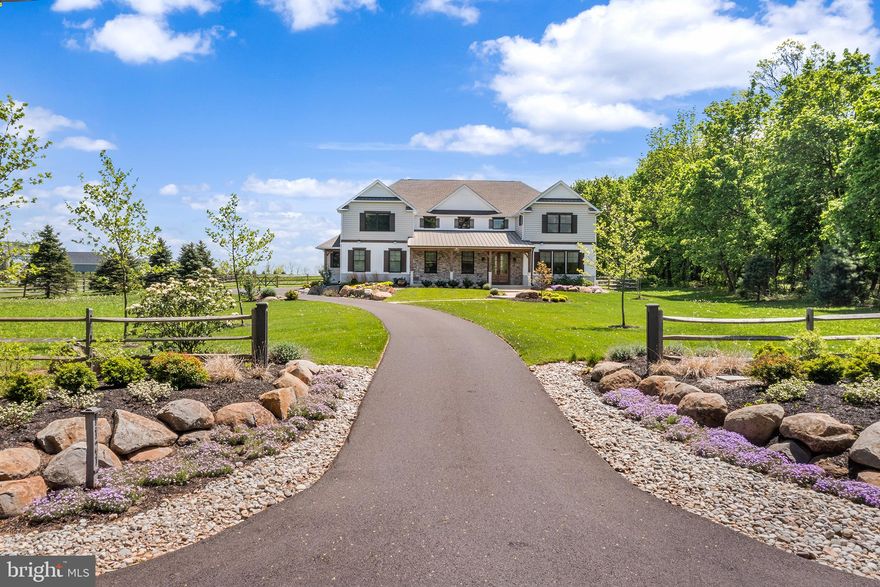 Nearly new Custom Model Home for Sale.  You can have new construction now!
A rare opportunity to own a 5 bedroom custom-built modern farmhouse in one of Bucks County’s most exclusive locations in the Vineyard at Peace Valley community.   Located walking distance to Lake Galena offering quiet every day living, with easy access to major roadways, shopping, local restaurants, parks, and the highly sought-after Central Bucks School District.    Beautiful fenced in back yard.
Enjoy walking, kayaking, boating, biking, hiking and picnicking at Peace Valley Park and Lake Galena.
This custom 5-bedroom modern farmhouse is on a beautiful 1.88-acre lot. This home is full of high end custom finishes with high-quality craftsmanship and attention to detail.    You will enjoy sitting on your covered front porch featuring elegant timber columns, a grand entrance with double knotty alder solid wood doors, and a blend of siding and stone.  Listen to the tranquil sound of the water feature while you enjoy the beautiful extensive front landscaping.   The rear deck features a pergola and expanded paver patio for everyday relaxing or indoor/outdoor entertaining.   
Inside is a grand two story foyer with views through wide-open floor plan with 10’ ceilings and 8’ solid core doors throughout.   The Gourmet Chef's Kitchen is the heart of the home with a large island, high end Cafe Appliance Package, open to the two-story grand 20 x 21’ dining area and great room with walls of glass to capture the views of the scentic back yard from every angle.   Two huge walk-in pantries featuring custom built in wood shelving for ultimate storage and organization.  The house has incredible custom millwork and built-ins throughout, with the signature craftsmanship and design that Casadonti Homes is known for.   The main level, features  en suite bedroom suite with an additional bonus room that can be utilized as a living room, flex space, 2nd office, playroom.  The large Mudroom with built-in cabinetry provides a separate family entrance with tons of storage space or area for pets.    The second floor featurins an Owner’s Suite complete with three closets, each with custom wood shelving. The Owner’s Suite Bathroom offers features a free-standing soaking tub, large double bowl vanity, walk-in shower with custom tile details, and linen closet.  Three additional large bedrooms with spacious closets, all featuring custom shelving, provide comfortable living spaces. An hall bath with designer vanity and tile details and a huge laundry room with cabinetry complete the second floor.  This remarkable home offers five bedrooms, two bonus/flex spaces, and 3.5 baths, with open gathering areas and private office and bedroom suite and flexibility to suit your needs.   This home features an oversized three-car garage and full basement with high ceilings ready to be finished.  There is an Option for the Builder to add an additional full bathroom on the second floor if Buyer chooses.    Buyer can select layout and design.  This is a limited opportunity to own a nearly new luxury custom home in The Vineyards at Peace Valley Winery built by Casadonti Homes.  Enjoy the best of both worlds with quite country living, with modern amenities and conveniences walking distance from Lake Galena and just minutes from downtown Doylestown..  This house has it all!