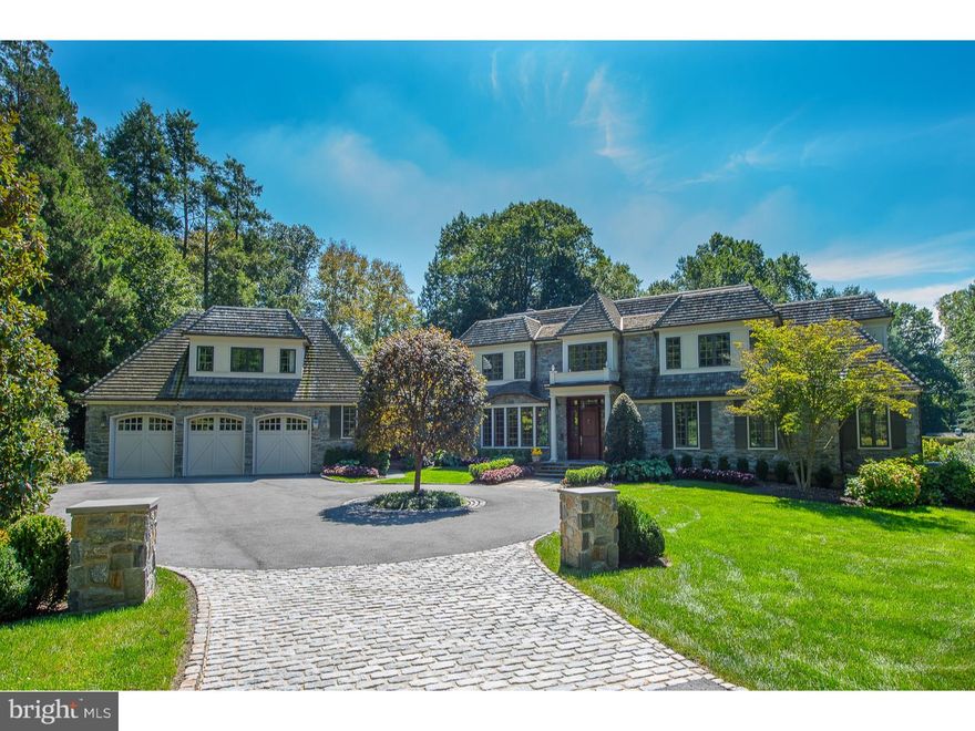 Located on this premier Main Line Road, you'll find a beautiful 1.62-acre property in absolutely move-in condition. There are no improvements left to do here; it's been updated and improved by its present owner with style and sophistication combined with ease and comfortable living spaces. The detailed architecture includes beautiful wide-planked hardwood floors, high-end solid wood doors, custom cabinetry, and an open staircase. Upon arriving at the Belgian block driveway entry, you approach the elegant circular, beautifully planted island.  The entry is bright and inviting with alcoves to display your artwork. The step-down living room with fireplace has French doors leading to the rear grounds. A study off the foyer has a wall of rich walnut cabinetry. The gourmet kitchen is equipped with two dishwashers, both a wall oven and range oven, a large center island with counter seating, and new Sub-Zero refrigerator. Off the kitchen is the butler's pantry with refrigerator for wine and food. Adding to the abundance of cabinetry, even the mud room has custom storage and counter space.  The family room adjoining the kitchen has custom-built cabinets which house the TV, shelving, and wet bar behind doors. Down the gallery hall is the master bedroom. Here you'll find a large room with a wall of windows with access to the grounds. The master bath has separate vanities, a large shower, and a separate infinity bathtub. The oversized walk-in closet is outfitted with drawers providing ample room for everything. The dazzling 2nd floor has four large bedrooms with walk-in closets.  Two bedrooms are ensuite along with three baths.  In addition to the bedrooms, a large, wonderful, whimsical room plus a billiards room are on the 2nd floor. Your guest accommodations are also met in the home. Privately located is a spacious bedroom with bath and two large closets. If entertaining is what you desire, the outdoor contains a swimming pool with slate decking and a covered lounging area for eating and relaxation. Here is the opportunity to live on this prestigious, quiet road with easy access to the train, major highways, and Center City Philadelphia.