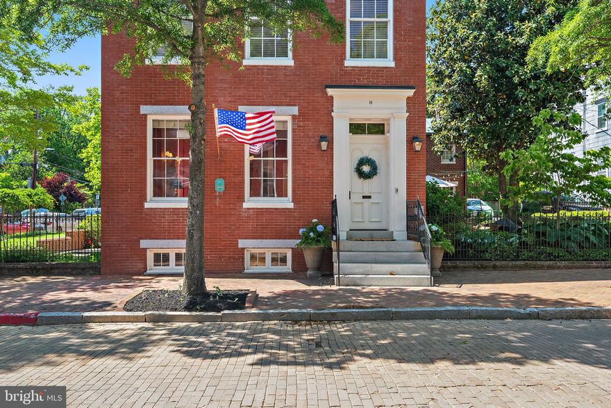 “A truly exceptional historic residence is now available in the heart of downtown Annapolis. Welcome to 16 Maryland Avenue, a distinguished circa-1830 Greek Revival home masterfully restored in collaboration with the renowned Hammond-Wilson Architects. Perfectly positioned just steps from State Circle and the United States Naval Academy, this iconic three-story brick property seamlessly blends timeless architectural beauty with sophisticated modern livability.
The main property features 4,474 square feet of refined above-grade living space, complemented by a fully legal, licensed lower-level apartment that offers immense versatility for multi-generational living or premium rental income. In total, the property features six bedrooms, 4.5 bathrooms, and beautifully curated living spaces defined by rich period details, soaring ceilings, and remarkable craftsmanship. Six fully rebuilt, functional wood-burning fireplaces (three equipped with gas starters) serve as stunning architectural focal points throughout the home.
Equally captivating are the enchanting outdoor spaces. Here, manicured grounds, lush landscaping, vibrant flower beds, and a serene koi pond create a private garden retreat rarely found downtown. Set on a prime 7,324-square-foot lot along one of the city’s most coveted historic streets, the property offers tranquility just moments from the waterfront and bustling downtown scene.
Zoned as a two-family residence, this remarkable property represents a rare, premium investment or a luxurious private estate. Residents will enjoy an unmatched lifestyle, surrounded by boutique shopping, acclaimed waterfront dining, art galleries, historic landmarks, and the unmistakable charm of Annapolis Harbor. Elegant, iconic, and rich with history, 16 Maryland Avenue represents downtown Annapolis living at its absolute finest.