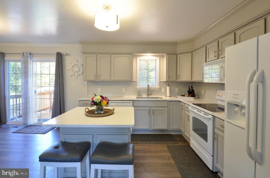 MOVE RIGHT IN to this TOTALLY UPDATED 3BR/2BA RAMBLER in ANNA COVES subdivision.  With a GREAT location on the PUBLIC side of the Lake and only a few MINUTES away from Food Lion,  it is a PERFECT weekend or full time retreat!  VERY PRIVATE  and LEVEL 1.8 Acre lot.  Beautiful kitchen with QUARTZ countertops & ISLAND.  UPDATED FLOORING & LIGHTING throughout.  NEW HVAC installed June 2019.  Asphalt drive & pad provide plenty of space to park your boat/RV/cars.  Enjoy your morning coffee on the FRONT PORCH or a  cool beverage on the NEW REAR DECK!  There is a FULL, UNFINISHED BASEMENT with BATH ROUGH IN and WALK UP STAIRS ready for you to finish and DOUBLE the home's square footage or for use as storage.  COMMUNITY AMENITIES are just a few blocks away and offer a picnic area, boat ramp, boat slips & beach area!
