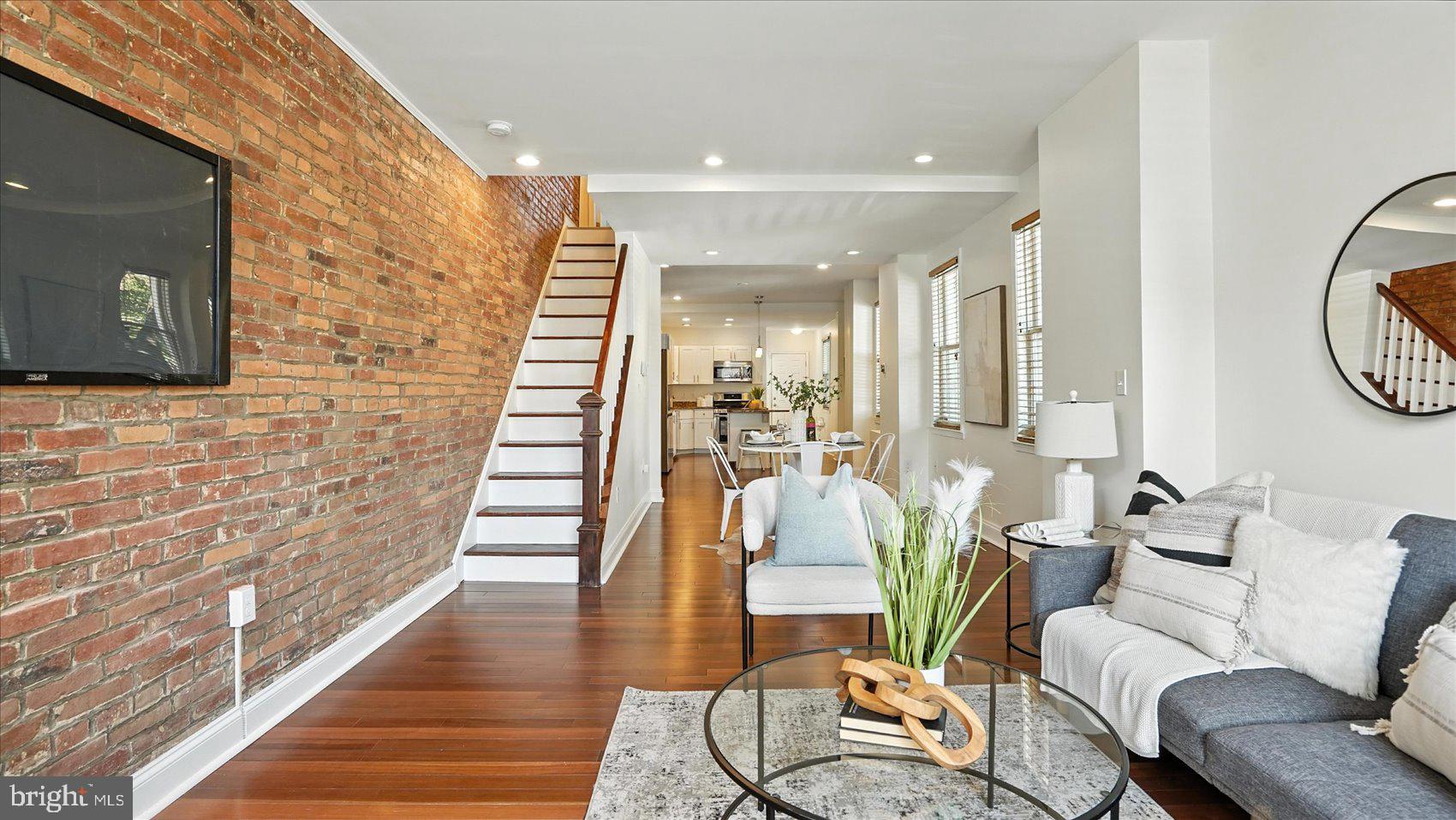 Welcome to your next home in the heart of Brewers Hill—where classic Baltimore charm meets modern comfort. This beautifully maintained 2-bedroom, 2.5 bathroom rowhome offers exposed brick walls, gleaming hardwood floors, and abundant natural light throughout.
The main level boasts a stylish kitchen featuring stainless steel appliances, a kitchen island perfect for your morning coffee or evening wine, and an open layout that’s ideal for entertaining. Upstairs, the spacious primary suite includes a luxurious soaking tub, a separate shower, and thoughtful finishes that make it a true retreat.
The lower level provides flexible space—perfect for a third bedroom, home office, or cozy family room. As an end-of-group home, enjoy additional privacy and extra light. And don't forget the coveted parking pad in the rear—a rare find in this desirable neighborhood.
From top to bottom, this home is a perfect blend of Charm City character and everyday convenience. Don’t miss your chance to call it home!
** PLEASE CONTACT CO-AGENT WITH ANY QUESTIONS **