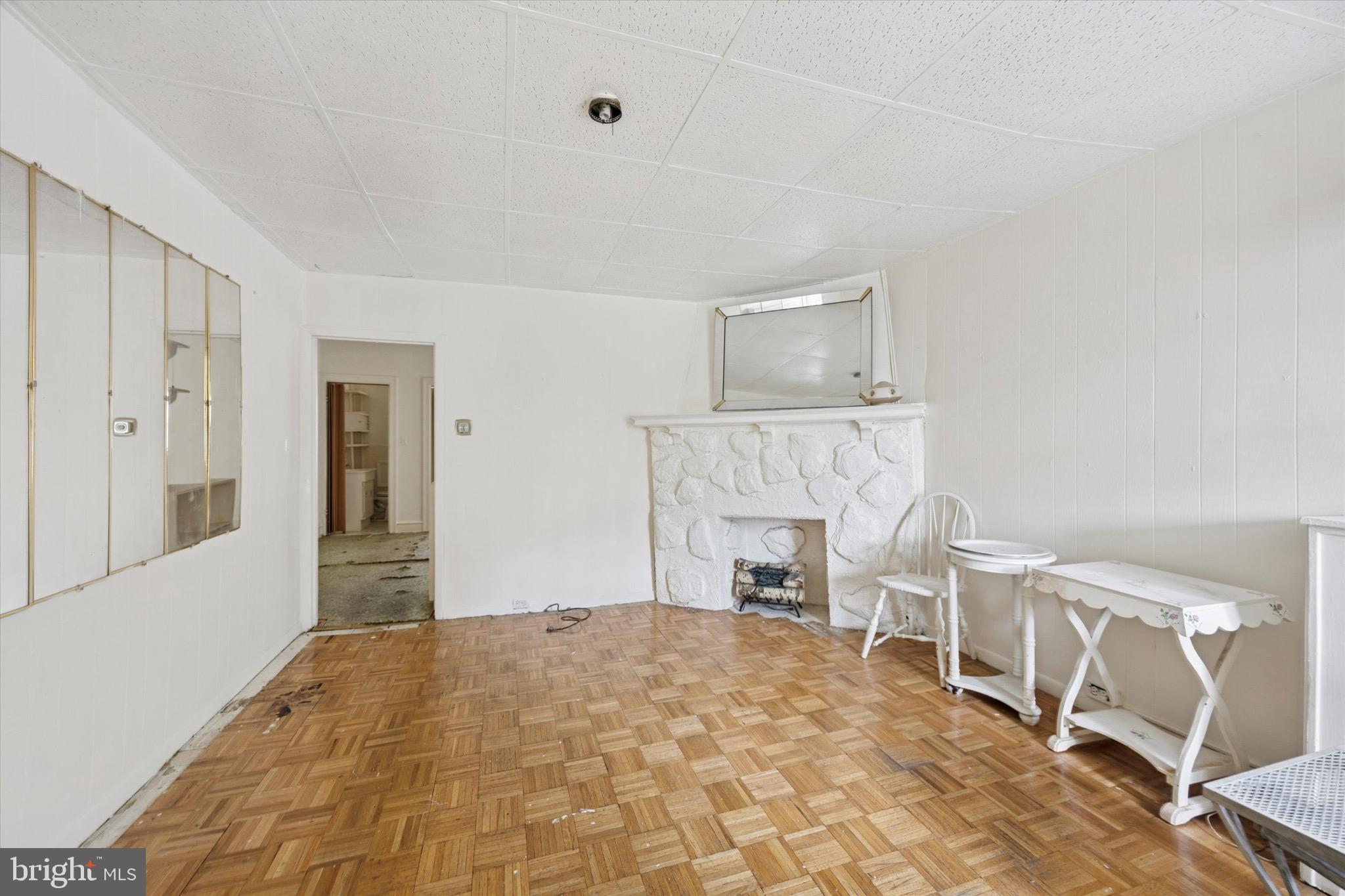 Excellent Investment Opportunity in Olney! Built in 1940, this 1,210 sq. ft. duplex offers tremendous potential for renovation and long-term value growth. The upper unit features one bedroom and one bath, ready for updates. The lower unit also offers one bedroom and one bath, plus access to the garage and basement. It includes hardwood and carpet flooring, and a charming fireplace with a mantel that adds character to the living space. While the property requires major rehabilitation, it provides a blank canvas for investors to design modern upgrades and maximize rental income. Outside, you’ll find an attached rear-entry garage for convenience and extra storage, along with a welcoming front porch to boost curb appeal. Located just one block from Einstein Hospital and close to the Fern Rock Transit Center, this property is perfectly positioned for tenants seeking quick access to public transit, healthcare, and other urban amenities. A prime choice for investors looking to tap into the growing rental market in Olney.