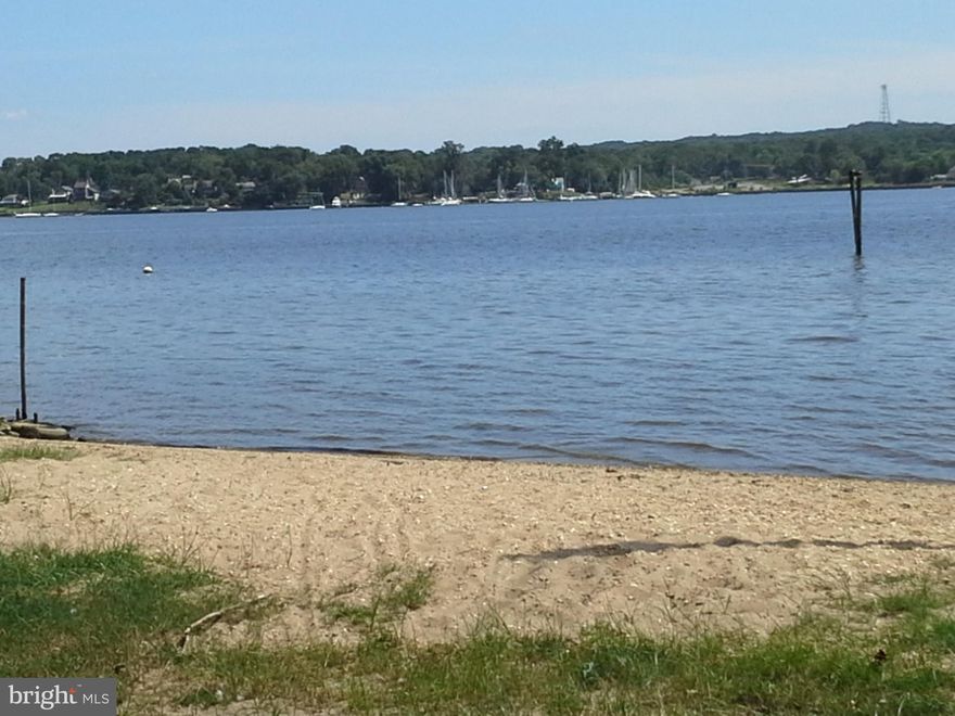 LIVE AND PLAY ON THE BAY WITH THIS GREAT HOME ONLY 150 FEET FROM A SANDY BEACH ON THE NORTH EAST RIVER. IF YOU LIKE THE WATER AND BEACH LIFE THIS ONE IS FOR YOU.