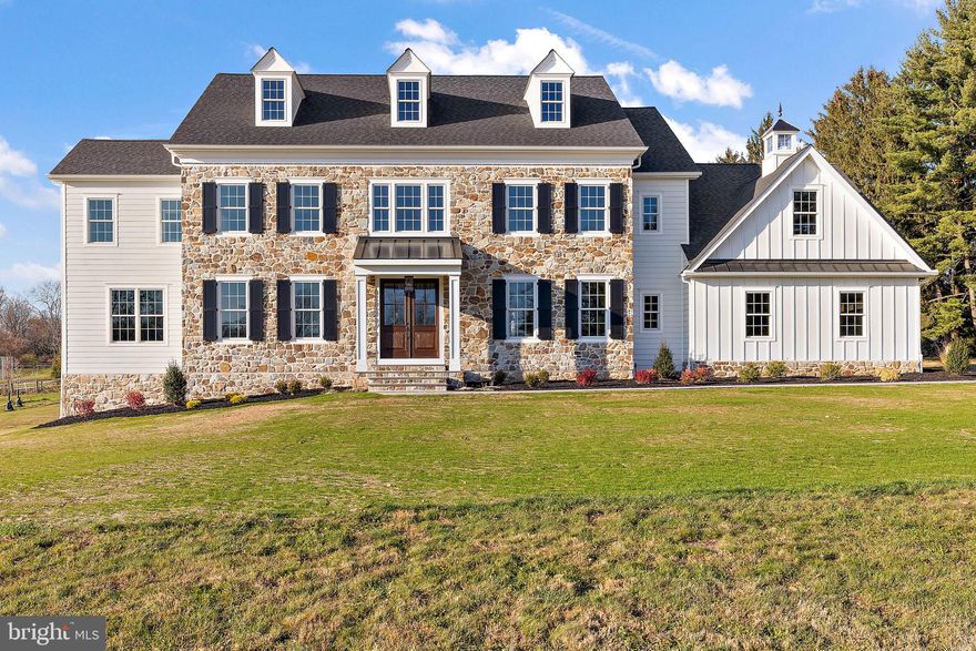 PLEASE NOTE:  INTEREST RATE BUY DOWNS ARE NOT AVAILABLE FOR JUMBO LOANS ( LOANS OVER $726K) BUT WITH AN ACCEPTABLE OFFER, SELLER IS WILLING TO GIVE A  SELLER ASSIST TO OFFSET THE INTEREST RATE BY 2% THE FIRST YEAR AND 1% THE SECOND YEAR ALLOWING TIME FOR BUYER TO REFINANCE.  This stunning new construction home is now ready for it's new owners!  Introducing Red Barn Farms, a new community of only four luxurious homes set on large, open cul de sac lots.  Designed by McIntryre and Capron, and built by the trusted local family builder, By Design Homes, LLC whose remarkable quality workmanship showcases great attention to detail.  This stunning natural stone and white James Hardie  siding home features accents of black metal roofing, vertical siding and is topped with a custom-built glass cupola with copper weathervane. Notice how the stone wrapped foundation gives a quality feel to this home. Enter through the custom-built portico with large square columns and then through the stained wood, 8 ft. double front doors.  You will immediately appreciate the great sight lines and custom millwork found throughout this home. This timeless and transitional home exudes elegance and was designed with an eye towards a timeless style. Many of the hard finishes are details found in homes of the past and which to this day are still admired. The flexible and open 5/3/1 floor plan is thoughtfully designed, with tons of storage and large closets.  The mudroom has a large walk-in closet with custom closet organizer and long built-in bench for everyone’s things.  The separate laundry room has a natural slate floor and white cabinetry with quartz countertops, and outside entrance to back yard.  We have thoughtfully left space for that important second fridge. The kitchen is perfectly designed, with the sink at a triple window that leaves the large island wide open and perfect for entertaining or everyday family dining.  The island seats 5 and has an upscale mitered quartz countertop with a matte finish that looks just like marble but without all the worry.  The kitchen has classic white cabinets with a warm wood island which are highlighted by eye catching gold light fixtures.  Stylish bar with white cabinetry, wine fridge, and seeded glass cabinetry above makes a lovely spot for serving drinks.  Elegant dining room with custom trim design on ceiling, wainscoting and sparkling gold chandelier and sconces.  The living room has been scaled down in size and could be used as second office.  The spacious family room is highlighted by a  coffered ceiling, stone gas fireplace, and expansive wall of windows that bring in plenty of natural light. The handsome first-floor office is tucked away and has incredible floor to ceiling trim work, lots of windows and glass French door. The primary bedroom has an eye-catching tray ceiling with custom trim work and 2 walk in closets with custom closet organizers. The stunning primary bathroom has Carrara marble heated floors, marble countertops, and soaking tub set on diagonal framed by 2 windows.  4 additional bedrooms are served by a jack and jill bath and a hall bathroom.  The timeless bathroom tile selections allow you to easily add your own style. The 5th bedroom is quite large with a custom built in window seat and would be perfect for a bonus room, guest room, media room or play room.  Other important details to note are: site finished 5” white oak floors, fabulous light fixtures,  glass transoms, built in speakers, oversized 3 car garage, large composite deck with white railings, 9’ ceilings on both floors and basement level.  Red Barn Lane is located right off scenic Morstein Road and provides a serene and tranquil country setting even though it’s just a mile away from Rte 202 and Rte 30.    Desirable Great Valley Schools. Taxes to be verified by buyer.  Listing agent has financial interest and is related to seller.