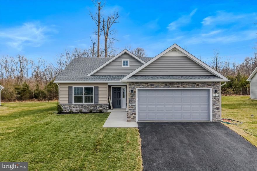 Experience exceptional single-level living in The Lakes at Martinsburg, one of Berkeley County’s desirable new home communities. This brand-new single level home features approximately, 1,650 finished sq. ft of living space, a spacious 2-car garage, and a beautifully flat .25-acre lot—perfect for easy outdoor enjoyment. Inside, you’ll find 3 bedrooms, 2 full bathrooms, and a dedicated laundry room with upgraded cabinetry for organized storage. The kitchen showcases upgraded white cabinetry, durable quartz countertops, and modern LVP flooring throughout—no carpet anywhere, offering low maintenance and high style. The covered rear patio extends your living space and is ideal for relaxing or hosting gatherings. Located on the north side of Berkeley County, WV, this home offers excellent convenience for Maryland commuters, with quick access to major routes and everyday amenities. Enjoy the added advantage of lower West Virginia real estate taxes compared to Maryland, making this an appealing option. Community amenities are a true highlight, including a fenced-in dog park, a fenced playground, and a covered pavilion picnic area—perfect for outdoor leisure, fresh air, and year-round enjoyment. Special Incentive: The builder is offering closing cost assistance when using the preferred lender. (Borrowers must qualify.)