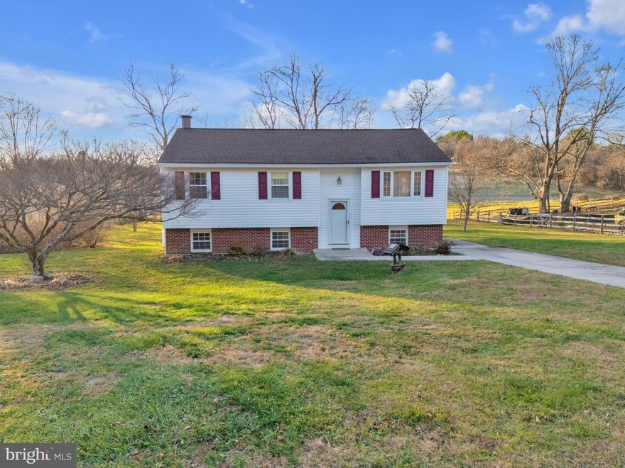 Welcome Home to this charming 3 bedroom 2 and a half bath split foyer, perfectly situated on just over half an acre in one of the area's most beautiful and sought after neighborhoods. From the moment you arrive you'll appreciate the peaceful setting, mature trees and welcoming curb appeal. Step inside to a light filled layout designed for comfortable everyday living. The living room flows easily into the dining area and kitchen. While the well appointed  kitchen offers ample cabinetry, generous counter space and newer appliances. The bedrooms are generously sized and share a well maintained full bath. The lower level has additional family living space with a second kitchen/dining room and another bath and a half. 
Outside the expansive lot provides lots of possibilities - gardening, play, outdoor dining, or simply relaxing and enjoying the serenity of the neighborhood. Don't miss your chance to make this beautiful property yours!