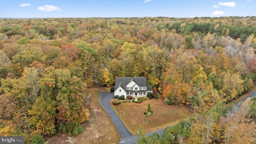 CLASSIC CHARM AND MODERN COMFORT COLLIDE IN THIS MAGNIFICENT ESTATE!!  NESTLED ON OVER 3  PRIVATE ACRES  IN QUIET COMMUNITY SURROUNDED BY MATURE TREES, YET JUST MINUTES FROM SHOPPING, DINING, AND MAJOR COMMUTER ROUTES. **MINUTES FROM BEAUTIFUL CURTIS PARK, A 76 ACRE COUNTY RECREATIONAL AREA FEATURING AN OLYMPIC SIZE SWIMMING POOL, 18 HOLE GOLF COURSE, TENNIS COURTS, SOCCER FIELDS, SKATE PARK, PLAYGROUND, 18 HOLE DISC GOLF COURSE, HIKING TRAILS, AND FISHING AT THE ADJOINING 91 ACRE CURTIS PARK LAKE.** THIS HOME COMBINES THE BEST OF PRIVACY, CONVENIENCE, AND MODERNITY!  COMING IN AT 6200+ SQFT, YOU ARE SURE TO NOT RUN OUT OF SPACE..AS YOU ENTER THIS HOME YOU WILL BE MET WITH A CLASSY AND ELEGANT 2 STORY FOYER WITH SOARING 20+ FT CEILINGS, AND BEAUTIFUL CURVED STAIRCASE.  THE FORMAL LIVING AND DINING AREAS OFFER TIMELESS APPEAL, AND LEAD TO YOUR BEAUTIFUL SUNROOM, FEATURING ITS OWN PRIVATE WALK OUT DECK,  GIVING YOU  AN ABUNDANCE OF SPACE FOR FAMILY GATHERINGS, HOLIDAY EVENTS, BIRTHDAY PARTIES, OR ANY OF YOUR ENTERTAINMENT NEEDS.  THE OPEN-CONCEPT FAMILY ROOM IMPRESSES WITH SOARING CATHEDRAL CEILINGS, A COZY GAS FIREPLACE, AND A GRAND WALL OF ARCHED WINDOWS THAT FRAME THE GORGEOUS  WOODED BACKDROP.  THE LARGE KITCHEN IS THE HEART OF THE HOME—FEATURING GRANITE COUNTERTOPS, STAINLESS STEEL APPLIANCES, A LARGE CENTER ISLAND,  BUTLER'S PANTRY, BUILT IN DESK & SHELVING, AND A BREAKFAST AREA THAT OPENS TO THE PRIVATE BACKYARD AND LARGE BACK DECK. WHETHER YOU’RE HOSTING GATHERINGS OR ENJOYING A QUIET MORNING COFFEE, THIS SPACE DELIVERS THE PERFECT SETTING - SUITED FOR ANY OF YOUR NEEDS OR ANY KIND OF CHEF! UPSTAIRS,  YOU WILL BE AFFORDED THE CONVENIENCE  OF 4 AMAZINGLY SIZED BEDROOMS, AND 3 FULL BATHROOMS.  THE LUXURIOUS PRIMARY SUITE PROVIDES A PEACEFUL RETREAT WITH GENEROUS SPACE FOR A LARGE SITTING AREA, A SPA-INSPIRED BATHROOM W/ LARGE DOUBLE VANITIES, WALK IN SHOWER W. BENCH, SOAKING TUB,  AND TWO WALK-IN CLOSETS. IN THE HOMES LARGE WALKOUT BASEMENT YOU WILL FIND  THE 2 ADDITIONAL BEDROOMS, AND ONE FULL BATH, BUT IT DOESN'T STOP THERE. ENJOY THE LARGE REC ROOM CAN BE USED FOR A MULTITUDE OF THINGS, IN LAW SUITE, GAME ROOM, ADDITIONAL STORAGE, YOU NAME IT!  THE LARGE PAVED DRIVEWAY AND THREE CAR GARAGE MAKE PARKING AND VEHICLE/ TOY STORAGE A BREEZE!  GRACEFUL, WELCOMING, AND BEAUTIFULLY DESIGNED — THIS HOME OFFERS THE PERFECT BLEND OF SOPHISTICATION AND EVERYDAY COMFORT. WHETHER HOSTING GATHERINGS IN THE OPEN LIVING SPACES OR ENJOYING QUIET MOMENTS BY THE FIREPLACE, YOU’LL FIND COUNTLESS REASONS TO LOVE EVERY CORNER.  DO NOT WAIT! CALL TODAY TO SET UP YOUR OWN PRIVATE SHOWING! ** BE SURE TO ASK YOUR AGENT ABOUT THE HOMES ASSUMABLE  2.75% VA LOAN AVAILABLE FOR THOSE WHO QUALIFY!!**