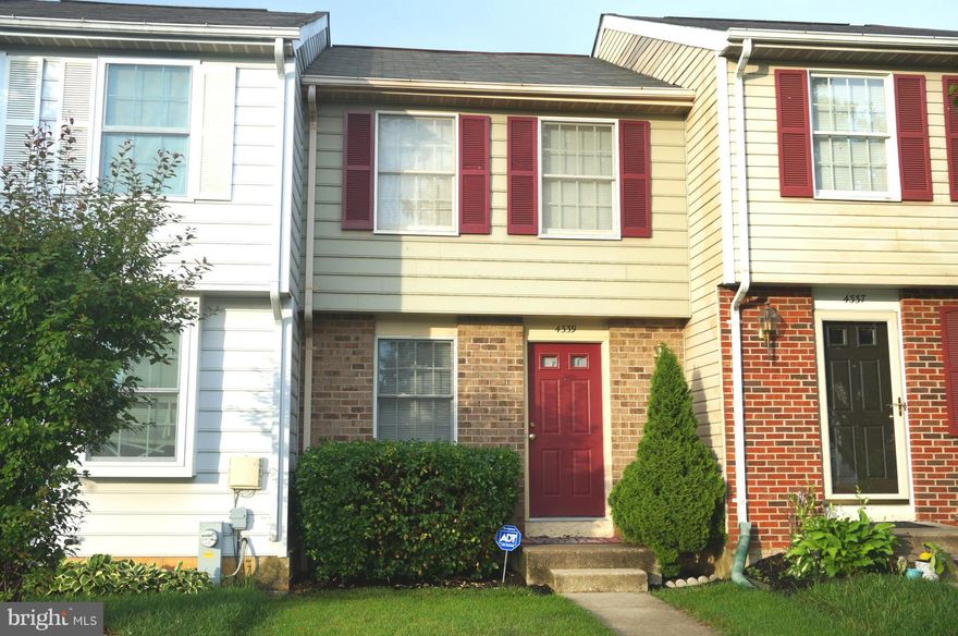 Must See! 3 BR, 2 BA, Townhome located on a quiet cul de sac graced with garden style canopy trees. Sophisticated Cherry floors. 3 yr old roof!  This home is move in ready. Large windows on all levels allow natural light to pour in. Master bedroom  with tons of  closets. Assigned parking direcly in front.  NE Consortium Schools. Come fall in love.