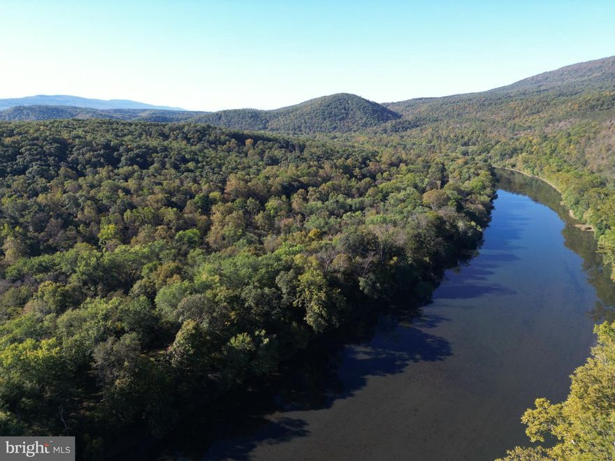THE ONE YOU HAVE BEEN SEARCHING FOR!

This property offers a little something for everyone. With almost 1500 feet of Potomac River frontage you are bound to find a place to fish, float, swim or just listen to ducks and geese go by.  The trails throughout the property give you the ability to enjoy the entire property not just the water's edge. Are you a hunter? The small clearing in the middle of the property is currently used as a food plot with a small shed strategically placed in the corner for concealment.

Want to have friends and family enjoy your new parcel with you?  The large 30x15 patio is in a fantastic location to have a riverside picnic or barbecue. The covered platform which is 15x15 gives you a perfect area to enjoy a cup of coffee and watch the early morning fog lift off the river. The storage shed gives you ample space to store tubes, floats, coolers or kayaks within its 10x14 walls.

Want to build a home? Lot 6 features a 3 bedroom perc that was completed and recorded with the county in 2018. 

The Jayco 5th wheel camper conveys with the property and being sold AS-IS.
