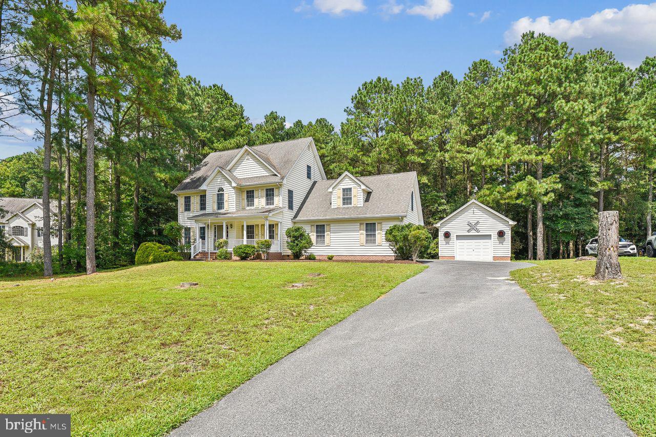 Welcome to this inviting home in the cozy, quiet community of Cooper Landing. This well-kept, single-owner home offers a great mix of comfort & practicality. Entering the home, you’re greeted by a traditional yet open layout featuring lovely hardwood floors throughout the main areas of the 1st floor. On your right is a full-size dining space that could easily be used as a formal living or office space. On your left is the oversized living room featuring lots of built-in shelving with cabinet storage & a gas fireplace, perfect for cozy evenings or entertaining guests. Moving to the rear of the home is the lovely kitchen which includes an island offering lots of storage & brand-new Fantasy Brown granite counters! There’s even space to add a small breakfast table in front of the sliders opening to the sunroom which features coffered ceilings, LVP flooring & tons of windows overlooking the private, elevated rear yard. Conveniently located, the laundry room & a half bath are just off the attached 2-car side-entry garage. The 2nd floor features a primary bed/bath suite with walk in closet and 2-3 additional bedrooms with LOTS of storage including a huge 3rd floor walkup attic! Brand new carpets were just installed throughout the 2nd floor & the master suite was freshly painted. The 2nd floor huge bonus/flex space gives you lots of options for how to use the extra room – consider a 4th bedroom, huge playroom/game room, work out space or an oversized office – just let your imagination run wild! Last but not least, there’s a detached 1-car garage – the perfect spot for additional storage or tinkering on projects. This beautiful home sits on a high, private lot, offering a peaceful setting within a small, well-kept community just south of Fruitland/Salisbury, Maryland. You’re also just minutes from South Upper Ferry, affording easy access to Salisbury’s West Side! This is a great opportunity to own a comfortable, well-located home so come see it for yourself! Septic sized for 6 full-time residents.