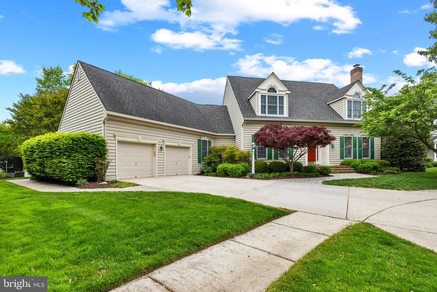Tucked away on a private cul-de-sac in one of Annapolis's most coveted enclaves, this exceptional residence offers the refined living the Chesapeake Bay region is celebrated for. From the moment you arrive, beautifully manicured landscaping and an elegant facade set the tone for what awaits inside.

Hardwood floors flow throughout the main level, anchoring an open floor plan where formal and informal living spaces are thoughtfully balanced. A gracious formal living room with a fireplace provides an elegant setting for entertaining, while the informal living room,  anchored by a second fireplace, offers the kind of relaxed comfort that makes a house feel like a home.

The heart of it all is a stunning two-story great room off the kitchen, where soaring ceilings soar overhead and natural light pours in from every angle;  a breathtaking space that never loses its ability to impress. The chef-inspired eat-in kitchen is equally spectacular, appointed with a large center island, Corian countertops, gas cooktop, and dual wall ovens. Whether hosting an intimate dinner party or a festive gathering, this kitchen performs flawlessly. Recessed lighting throughout the main level lends a polished, gallery-like ambiance at every turn.

The coveted first-floor primary suite is a true sanctuary, offering a generous walk-in closet and the ease of single-level living at its finest. First-floor laundry adds an everyday luxury that discerning buyers will immediately appreciate.

Upstairs, two spacious bedrooms share a well-appointed full bath, while a versatile loft overlooks the living spaces below, equally suited as a private home office, library, or lounge.

The finished lower level is nothing short of spectacular. Custom built-in bookcases, a third fireplace, a full bath, and a  wet bar make this space ideal for entertaining, relaxing, or hosting overnight guests in style. A whole-home generator ensures uninterrupted comfort in every season.

Outside, a paver patio and deck extend your living and entertaining space into the serene, landscaped backyard; the perfect backdrop for al fresco dining, morning coffee, or simply savoring the beauty of an Annapolis evening. A two-car garage completes this picture of thoughtful convenience.

This is Annapolis living at its finest; where classic elegance, modern comfort, and Chesapeake Bay charm converge into something truly special.