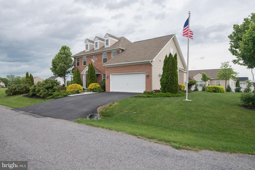 Elegant Former Model Home, 4 Bedroom 3 1/5 Bath Colonial on beautiful corner lot. Beautiful landscaping is low maintenance. Spacious main level has hardwood floors, formal living and dining areas, Gourmet kitchen with huge island and table for bar stools, Lovely breakfast room with doors to paver patio, trees surround the back for privacy. Enormous Master Suite. Centrally located, must see!