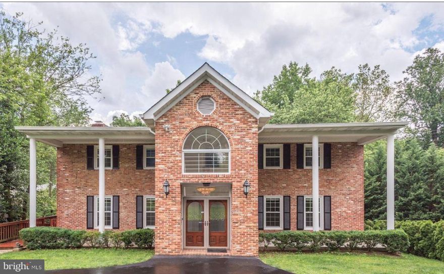 Tucked along a picturesque country lane, this exceptional McLean residence offers timeless Virginia charm with a thoughtfully reimagined main level designed for modern living and refined entertaining. The home features 5 bedrooms, 3.5 baths, a side load 2 car garage, fully fenced grounds, deck and a pool creating a serene, secluded retreat.  Perfectly sited on a private lane, the  stunning main level is the heart of the home, where an extraordinary gourmet kitchen with large granite island, custom cabinetry, and designer lighting opens to the family room with fireplace. Walls of windows frame tranquil views of the pool and landscaped yard, while the sunroom and oversized dining space create an effortless flow for sophisticated gatherings. This is a space you will never want to leave, bright, airy, and beautifully connected to the outdoors. The upper level features an expanded primary suite with fireplace, 3 additional bedrooms, while the lower level boasts a generous recreation room with wet bar and an additional walkthrough bedroom, ideal for guests or extended living. Replacement windows, roof, HVAC, and hot water heater provide peace of mind, while freshly refinished hardwood floors, new lighting, elevate the home’s turnkey appeal. Three fireplaces and professional landscaping complete the offering.  Pool! Located within the highly sought after Churchill Road, Cooper, and Langley High School pyramid, this home delivers privacy, elegance, and convenience in one of McLean’s most desirable settings.