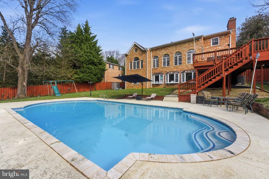 Private pool. Turn into circular driveway.  Set in one of McLean’s most sought-after locations, this home invites you into a lifestyle that feels both elevated and effortless. The main level is bright, open,  designed for connection, where everyday living and entertaining come naturally. At the center, a remarkable 17-foot island with seating for six becomes the place everyone gathers, whether for morning coffee or evening celebrations. Multiple prep areas, separate sinks, touch faucets, and a 45-inch workstation sink with integrated chopping board and strainer make cooking feel seamless. thoughtfully designed appliance suite includes a 48-inch range with griddle, speed oven, fully plumbed steam oven, warming drawer, and two dishwashers, ready to support anything from quiet dinners to larger gatherings. Details like a cup rinser, filtered water faucet, and instant hot water add comfort and ease to daily routines.Custom cabinetry offers smart, beautifully integrated storage, including spice drawers, utensil organization, and a concealed mixer cabinet. A hidden door reveals a walk-in pantry with a full-size refrigerator and generous storage, keeping everything within reach yet out of sight. A beverage fridge and toe-kick drawer, currently used as a pet feeding station, add to the thoughtful design.The main level flows with ease, offering spaces to relax, gather, and make your own over time. A rare opportunity to enjoy location, design, and lifestyle in the heart of McLean.