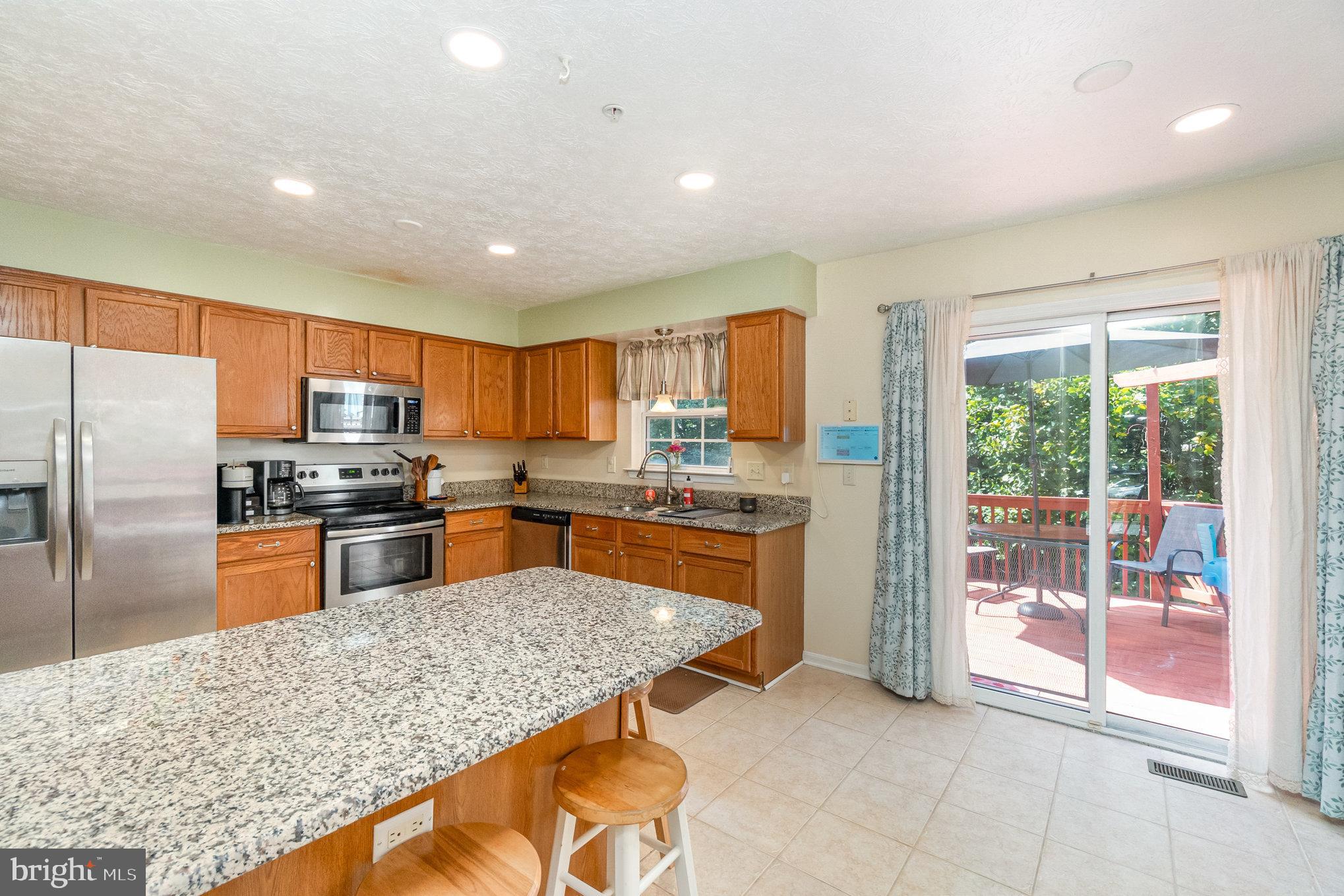 Well-maintained home with beautiful, private yard and deck to overlook the woods behind. The eat-in kitchen features granite counters, and breakfast bar, a huge pantry, ceramic tile and space for a table. The living room with a bay window brings in lots of light. On the upper level there are two large bedrooms with cathedral ceilings and nice sized closets, Upper bath is spacious with double sink vanity, a soaking tub and separate shower. Lower level has a large finished family room with walk-out, and unfinished laundry and storage space and a full bath. This home is located in a private court location and is convenient to all Havre de Grace has to offer.