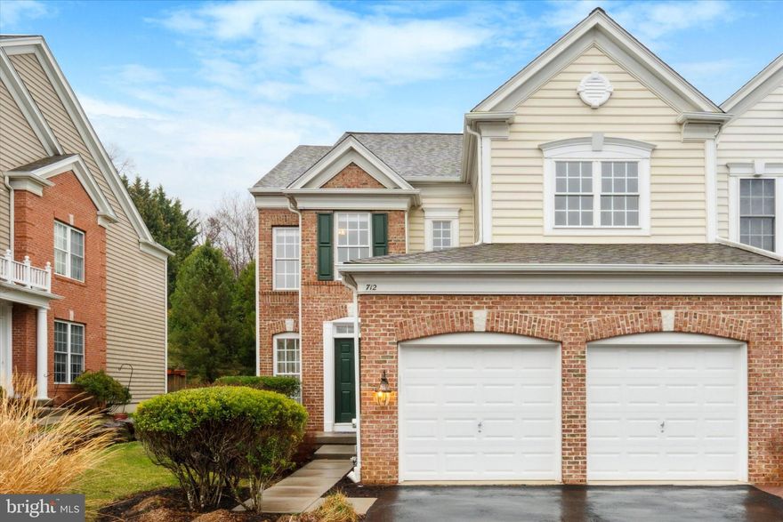 Walk to West Chester and the University from this lovely Mercers Mill  townhome.  A 2-3 bedroom End Unit with fresh paint and new carpeting, this home has been lovingly maintained by the original owners (and the HOA that installed new roof in 2023!).  Step into the inviting hardwood foyer with a cathedral ceiling and you’ll immediately notice all the sunlight streaming in from impressive six-foot windows on the main level (they’re five-feet tall upstairs).  The nearly 9-foot ceilings are accentuated by custom crown-moldings and there’s classic millwork and columns adding a touch of elegance throughout this beautiful home.  Note the double-sided glass fireplace (gas) between the living room and family room.  A sunroom leading to the (9’x15’) deck in back, a finished basement with plenty of storage and second level loft are just some of the features making this home so special.  Upstairs you’ll find a lovely primary suite with a tray ceiling and designer ceiling fan. A generous walk-in closet, two additional closets, and a makeup table frame a dressing area (5’x18’).  The luxury primary bath features two vanities, a soaking tub, and a very impressive (5’x5’) oversized walk-in shower.  The second bedroom has a doorway to the hall bath.  At the top of the stairs is an open loft/den/office, which was optioned as a third bedroom and can be framed in if needed.  Guests may prefer the office/bedroom on the lower level, which is part of a carpeted finished space featuring a high ceiling, recessed lighting and a large unfinished storage area that’s plumbed for another bathroom.  The kitchen is open to the family room and fireplace and offers plenty of counter and storage space.  You’ll find handsome solid oak cabinetry, a double wall oven, gas cooktop, built-in microwave and dishwasher, double porcelain sink with disposal, a pantry and a coat closet.  The kitchen walks out to the attached two-car garage (19’x19’) with electric opener and the home is wired for a security system.  High efficiency gas heat and gas hot water plus there’s PEX plumbing access in the basement.  Mercers Mill is a charming and sought-after community offering suburban serenity and urban convenience.  The Homeowner's Association handles driveway sealing, snow removal, lawn and common area maintenance and roofs but it is not responsible for other exterior building maintenance.  The community has a half-mile walking trail, is one block from Everhart Park, and is convenient to bustling downtown West Chester!   Welcome Home!