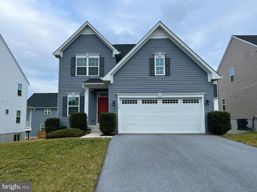 Location is fantastic on this one.  Minutes from the interstate and the Maryland border.  The home shows like a brand new property in excellent condition.  Open floor plan with the kitchen, dining and living all combined in one large area.  The kitchen is amazing with a large island, granite counter tops, stainless steel appliances and a pantry.    Composite deck off of the dining area perfect for outdoor dining.  Half bath on the main level.  Four great size bedrooms with the primary bedroom having two walk in closets.  Convenient bedroom level laundry with washer and dryer conveying.  Lower level has a huge family room with a walk out to the backyard.  Lower level also has storage and a rough in for an additional bath.  Don't wait to see this one.  Make your appointment today!