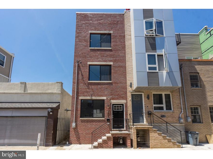 This Point Breeze new construction townhome has custom upgrades that truly sets itself apart. Included in the 3 bedroom 3 full bath open floor plan you'll find contemporary baseboards, casings, crown molding and wainscoting throughout. Make your way through the custom crown molding and wainscoted living room into the contemporary shaker cabinet open concept kitchen where you can enjoy your eggs and bacon at the 5' breakfast bar. From here head on out to the brand new back patio with pressure treated wood privacy fence where grill top story telling is sure to be had. Need to cool off?? The full size finished basement is the perfect space to get away or even take a refreshing cool shower on those hot summer days. The two oversized guest bedrooms on the second floor share an oversized full bathroom located conveniently adjacent to each bedroom. But the third floor master suite penthouse is where this home really gets good... TWO walk-in his and her closets and an en-suite master bathroom complete with 5' double vanity, wall to ceiling porcelain tile, oversized frameless glass tile shower and water efficient contemporary fixtures to boot. If that's not enough for you then step out onto the full size fiberglass roof deck where the Philadelphia city skyline views are sure to put your mind and soul at ease. Other notable features include, recessed LED SMART lighting throughout, under cabinet lighting, Russound System, quartz countertops, energy efficient stainless steel appliances, energy efficient Anderson Windows, Delos Vitamin C Shower Head and a Point Breeze location that is hard to top.