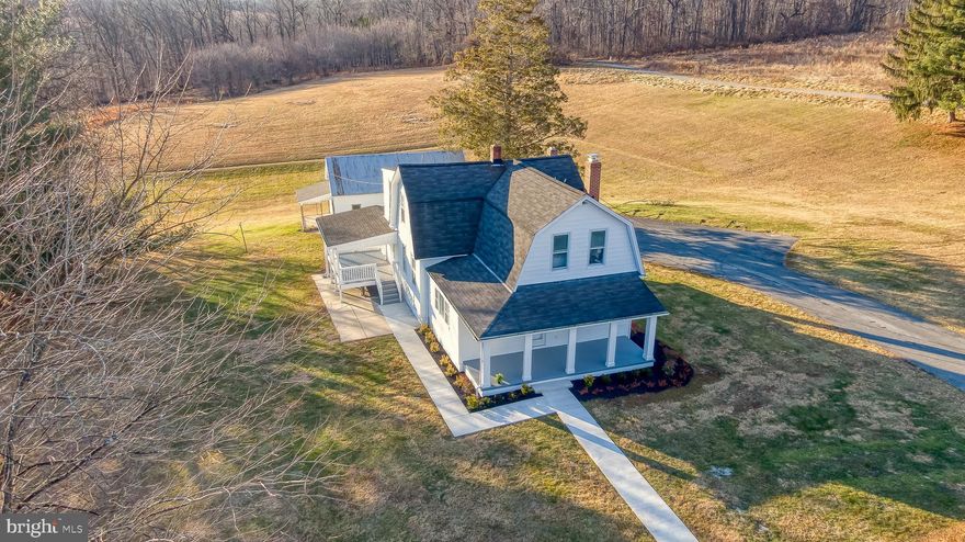 Nestled  on a 2.3 acre lot in the charming community of Sparks Glencoe, this beautifully renovated farmhouse-style home, originally built in 1898, has been thoughtfully updated to meet modern living needs while preserving its timeless character.   With a generous 2,541 sq. ft. of finished space, this residence offers 3-4 spacious bedrooms and 3 full bathrooms, ensuring comfort for all. Step inside to discover a warm and inviting interior featuring gleaming hardwood floors ,NEW kitchen w/upgraded counters, modern stainless appliances, large walk-in pantry and convenient main level laudry/mudroom,   Relax in the  cozy Living rm by the fireplace or entertain family and friends in spacious family room and dining room areas.  Main level also features BR/Office and full bath.  Upper level boasts Primary Bedroom suite with supersized walk-in closet and NEW private primary bath  plus 2 additional bedrooms with NEW hall full bath.   Plenty of storage space in the full basement with walk-out stairs to the yard plus 2 car detached garage with oversized parking pads perfect to fit plenty of cars/vehicles.  Relax and enjoy sunrise and sunsets on the covered front porch and covered rear deck areas.   With a major renovation just completed  ( which includes NEW HVAC & Electrical too ), this home is in excellent condition, ready for you to create lasting memories. Experience the perfect blend of historic charm and modern amenities in this delightful property.