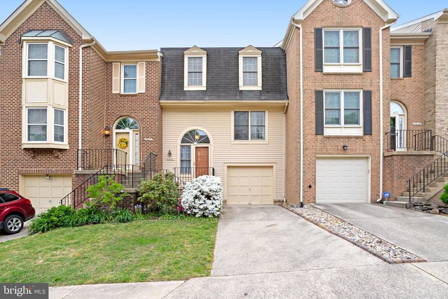 Beautifully maintained townhome in amazing location!! Eat in kitchen with newer granite and stainless opening to deck facing trees.  Open formal living and dining room combo with wood floors. Spacious primary bedroom w/cathedral ceilings, large walk-in closet, custom organizers; Skylight in primary bath makes it feel open and bright. Large basement den with woodburning fireplace opens to fenced patio area. Single car garage. Very walkable to shops and restaurants! Enjoy all the amenities of the Kingstowne community!