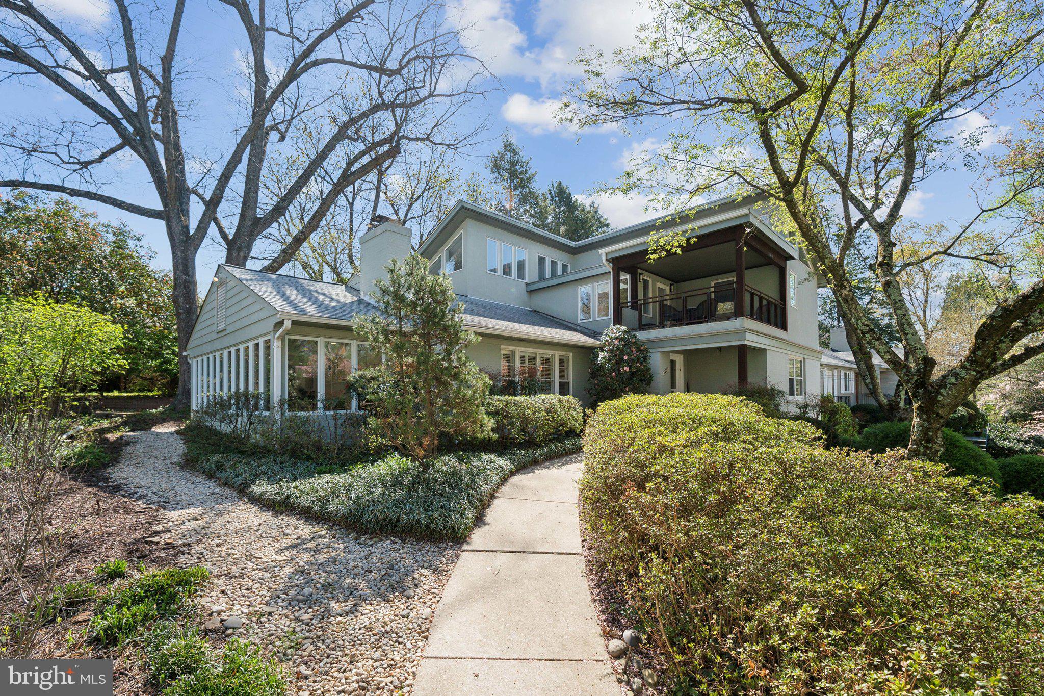 This light filled one-of-a-kind contemporary home is located in the highly desirable neighborhood of Rock Creek Hills, a stone’s throw from the walking trails of Rock Creek Park and with easy access to the Beltway. Its unique design includes a skylight and two balconies on the upper level, one facing the street and the other the backyard thereby providing outdoor access from multiple points in the house. The master suite includes a walk-in closet with built in cabinetry, a sitting area and bathroom with walk-in shower and a soaking tub. With all these architectural features you’d never know that this house is fully accessible on all three floors connected via an elevator. A second bedroom completes the upstairs design. On the main level you'll find two bedrooms, including one with an ensuite bath, plus a separate office space-perfect for working from home. The newly remodeled kitchen is both a showstopper and a chef’s dream leading to a bright, airy dining room and offering easy access to the back deck, making outdoor entertaining a breeze. The living room is warm and inviting, with built-ins and a cozy wood-burning fireplace. The lower level provides ground-level access from the garage and a staircase to the backyard. This space includes a generous family room with another wood-burning fireplace, a versatile bonus room-ideal for a gym, playroom, or office-plus a laundry room and ample storage. This home is truly a gem, combining style, functionality, and accessibility in a fantastic location.