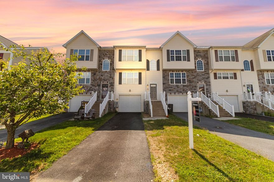 Welcome to this beautifully updated interior unit townhouse, built in 2011, offering a perfect blend of comfort and convenience. This home features brand-new luxury vinyl plank (LVP) flooring throughout and has been freshly painted.  The main level boasts a spacious living area, a separate dining room perfect for entertaining,  a kitchen, and a living room that flows seamlessly to the vinyl deck, ideal for outdoor relaxation. The property is enhanced with a vinyl privacy fence, ensuring a private and secure backyard space.  The upper level includes 3 bedrooms with ample closet space, while the basement offers a flexible space that can be used as a possible fourth bedroom, man cave, or perfect for that teenager who wants their own space. The basement also includes a half bath and a washer/dryer. Additional highlights of this home include a freshly painted garage floor and a prime location close to shopping, restaurants, and easy access to I-81. Don't miss the opportunity to make this move-in-ready townhouse your new home!