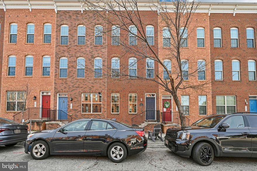 Welcome to 131 W Fort Ave, a beautifully maintained 4-bedroom, 4 full and 1 half bath home offering flexible, multi-level living in the heart of Baltimore. Designed with both comfort and versatility in mind, this spacious residence is ideal for modern city living.

Upon entry, you’re greeted by a generously sized flex space complete with its own full bathroom, perfect for a home office, gym, guest suite, or creative studio. The second level serves as the main living and entertaining hub, featuring a gourmet open-concept kitchen, seamlessly flowing into the dining and living areas, ideal for gatherings and everyday living alike.

The third floor hosts a luxurious primary suite, complete with a spa-inspired bathroom featuring a double vanity, soaking tub, and separate shower. An additional bedroom on this level includes its own en-suite bathroom, offering privacy and convenience. The lower level provides yet another bedroom with a private en-suite bath, perfect for guests or extended stays.

At the top, the fourth-floor rooftop deck delivers a stunning 360-degree view of the city skyline, an incredible space to unwind, entertain, and take in breathtaking sunsets.

Completing the home is a gated two-car garage, a rare and valuable feature in the city. With its thoughtful layout, multiple private suites, and exceptional outdoor space, this home offers the perfect blend of luxury, functionality, and urban lifestyle.