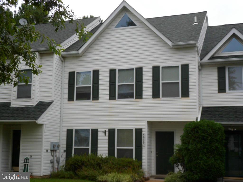 Charming town home located in beautiful water privileged community. Low maintenance, easy commute to Pax, and nearby sandy beach- providing true relaxation. This home also offers three bedrooms plus a generous loft plus. Fenced yard backing to trees gives you the privacy you need. Great patio