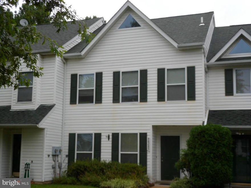 Charming town home located in beautiful water privileged community.  Low maintenance, easy commute to Pax,  and nearby sandy beach- providing  true relaxation.  This home also offers three bedrooms plus a generous loft plus.  Fenced yard backing to trees gives you the privacy you need. Great patio