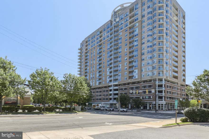 Welcome to this exceptional 1-bedroom + den condo in the highly sought-after Midtown Bethesda North (MBN) community in Rockville. This bright and stylish residence features a thoughtfully designed, spacious layout with a versatile den—perfect for a home office, guest space, or flex area to suit your lifestyle.

The home showcases beautiful hardwood flooring (installed September 2022), complemented by a modern kitchen with granite countertops and stainless steel appliances. The open-concept living and dining area flows seamlessly to a rare oversized private patio, offering the perfect setting for entertaining, relaxing, or enjoying outdoor living—an uncommon feature in this building.

Additional highlights include an in-unit washer and dryer, assigned parking, and a large dedicated storage space for added convenience. Patio furniture and window treatments are included, making this home truly move-in ready.

Residents of this full-service building enjoy an impressive array of amenities, including a rooftop pool, state-of-the-art fitness center, 24-hour concierge, private theater room, and a rooftop lounge with sweeping views.

Ideally located just off Rockville Pike, you’ll have easy access to shopping, dining, Metro, and major commuter routes. This is low-maintenance living at its finest in one of Rockville’s most desirable communities.  Mortgage savings may be available for buyers of this listing.
