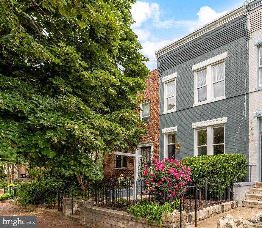 A captivating Capitol Hill rowhouse at 1234 D St SE emerges as a quintessential urban sanctuary, seamlessly weaving historical charm with contemporary refinement. Thoughtfully updated by conscientous owners, this three-bedroom residence offers nearly 1,700 square feet of living area across two levels with a sprawling outdoor space boasting park-like proportions. Beyond the idyllic garden, you’ll find 2 car parking along with a bonus outbuilding perfect for a workshop, yoga studio or home office. Nestled just moments from Eastern Market and Lincoln Park and steps from the fabled Adolf Cluss court, the location puts you at the vibrant heart of the neighborhood, and the property invites discerning buyers to become stewards of a home that resonates with the timeless spirit of one of the city’s most coveted historic districts.