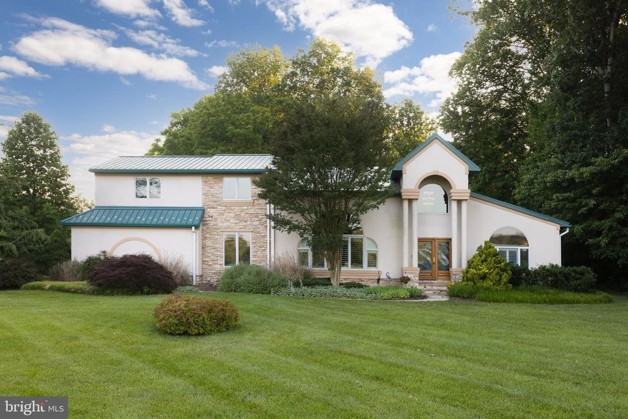Welcome to this one-of-a-kind, architect-designed contemporary home, custom-built by renowned local builder Glassman Construction. Perfectly situated on a serene 3-acre lot in Aberdeen with sweeping golf course views, this property blends sleek modern living with the tranquility of nature. A curved driveway leads to a side-entry two-car garage, complete with built-in storage closets to keep tools and seasonal gear neatly organized. Inside, the open-concept design shines with vaulted ceilings, large windows, beautiful new flooring, adding warmth and sophistication to the home’s contemporary aesthetic. The kitchen offers white cabinetry, stainless steel appliances, and a modern layout that flows seamlessly into the dining area perfect for both casual meals and elegant entertaining. The main-level primary suite is a true retreat, complete with dual walk-in closets, an ensuite bath featuring a walk-in double shower, and access to a private hot tub room with direct entry to the two-tiered deck. A second main-level bedroom, with built-in desk and bookcases, is ideal as a guest room or home office. Upstairs, a third bedroom, full bath, create a quiet and private living area—ideal for guests, teens, or multi-generational needs. Step outside to experience the property’s natural beauty with walking paths, a pond, and mature trees offering privacy and a deep connection to nature. The multi-level deck is perfect for taking in vibrant fall colors or enjoying peaceful evenings under the stars.