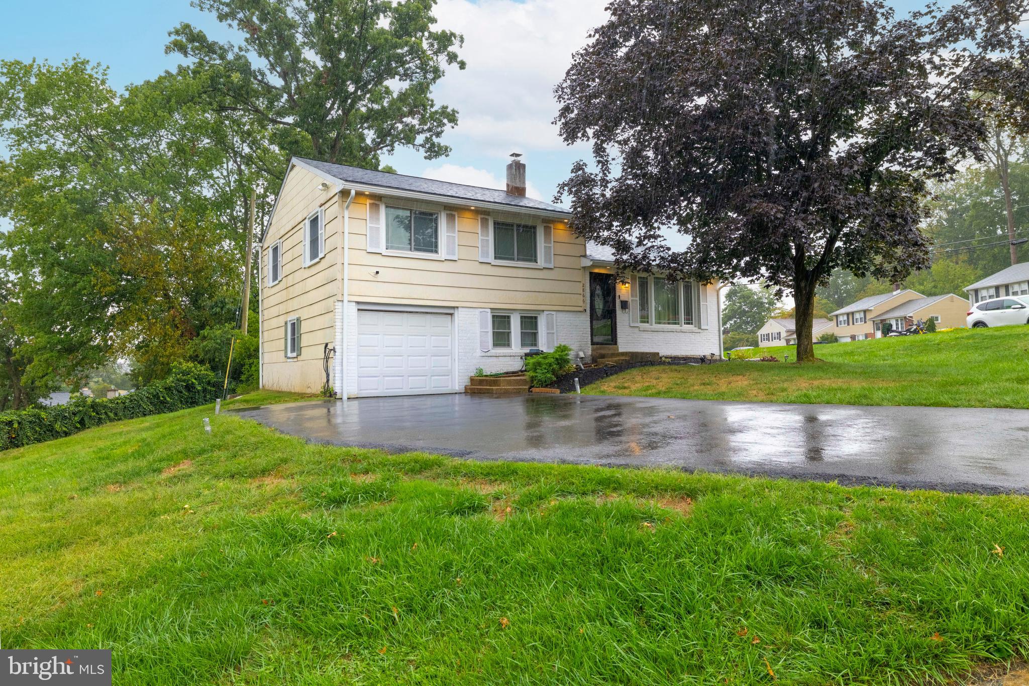 showings begin thurs. 9/25.Abington Woods Location says it all. Drive right up to your new home! Entry into the spacious living room home has hardwood floors throughout (except kitchen and new flooring in family room, & laundry room) The dining room is adjacent to the living room and opens to an ample size kitchen with newer 5 burner gas stove and newer refrigerator (dishwasher is non functioning) you will find plenty of cabinetry and counter space with the expandable breakfast bar. 5 steps up to the sedond level with king size main bedroom with half bath and walk in closet, 2nd bedroom has access panel to 1 of 2 attics, and a double closet. third bedroom has double closet plus a pantry type storage area. the Updated hall bath with tub/shower is nicely appointed with marble tile flooring. The hallways is a nice width and has an access closet to the 2nd attic. Family room is 5 steps down from kitchen and has sliders to the patio and yard. There is a generous laundry room with washer and dryer and tub, and access to the crawl space beneach th living room, dining room and kitchen area.. You can also access the one car garage with work shop area behind. House has solar panels (paying off on a monthly fee of $256.00 which buyer can take over) there is a security system with exterior cameras but excluded from sale.