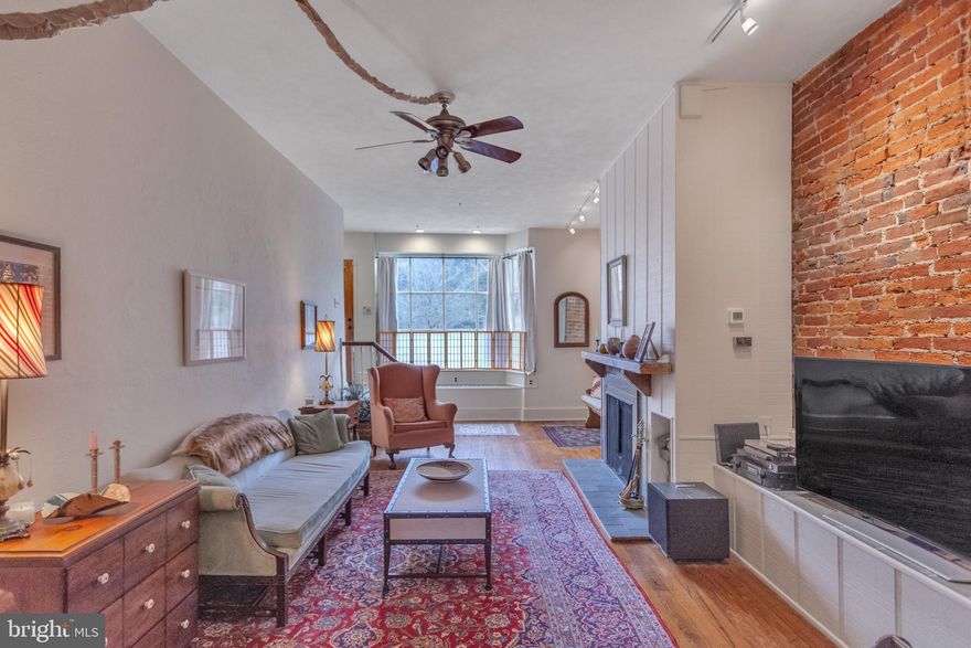 THIS HOME WAS FEATURED in the NEW YORK TIMES - December 21, 2016.   To read article by Michael Powell and view the slideshow, just google "What You Get - New York Times."   This Special Home is Full of Details and Character- Featuring 5 Full Bedrooms plus Den - 3.5 Baths - 3300 sq ft. - Runs Street to Street (18 x 100) with Private Garage and Fabulous Indoor Garden.   Sun-lit Slate Entrance leads to a Living Area with Exposed Brick, High Ceilings, Gas Fireplace and Original Gorgeous Wood Floors.   Step up to Beautifully Trimmed Dining Room with Skylight, West-Facing Window and Charming Powder Room. Kitchen - A Country-Style Gem with Italian Tile, Antique Cabinets, Spacious Island and Viking /Bosch Appliances.   Bright Eating Nook and Sitting Area open to the Enchanting Indoor Garden Art Installation with a Fountain/ Koi Pond and Gorgeous Greenery.  Large Private Garage and a Side Potted Garden.   Next Level - Features a Spacious Bedroom/Office,  Laundry Room, and Gorgeous Full Bath.  Master Suite - Light Filled Bedroom with a Spa Bath and Private Den/Sitting Room.  Third Floor offers 2 Bedrooms, 4 Large Hall Closets and a Huge Full Bath.  Top Level Features a Fabulous and Spacious  Sunny Art Studio with Skylights, Vaulted Ceilings, Exposed Beams and a Cozy Franklin Stove.   Basement houses  Mechanicals, Irrigation, Water Filters and Generous Work Space with Stainless Steel Sink, Cabinets and Storage.  This Home has all New 2 Zoned HVAC System and Many Newer Wonderful Details throughout.  Located in the  Blue Ribbon Award Winning Meredith Catchment.