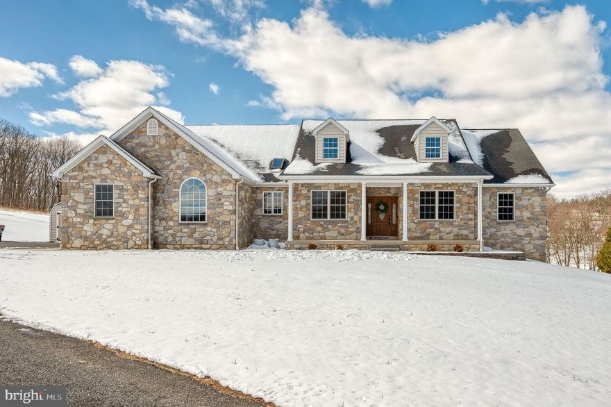 BETTER THAN NEW! This stunning custom-built stone rancher with a three-car garage showcases exceptional craftsmanship, luxury finishes, and meticulous attention to detail throughout. Completely refreshed with extensive high-end upgrades, this home offers the perfect blend of timeless design and modern convenience.
The fully renovated chef’s kitchen (2025) features premium GE Monogram appliances, elegant quartzite countertops, and an impressive 10-foot prep island, creating a beautiful and highly functional space for cooking and entertaining. Throughout the home you’ll find all-new ¾-inch solid oak hardwood flooring (2025) along with updated lighting and fresh paint (2025) that add warmth and sophistication to every room.
Major mechanical updates include a new HVAC system (2024) featuring an energy-efficient Bosch heat pump with backup propane furnace, providing year-round comfort and efficiency. The hall bathroom and laundry room were tastefully updated in 2024, complemented by new washer and dryer for added convenience.
Step outside to enjoy thoughtfully designed exterior improvements including a new concrete sidewalk, retaining wall, and low-maintenance landscaping, all leading to a beautiful patio retreat surrounded by peaceful wooded views and expansive open space—an ideal setting for relaxing or entertaining outdoors.
With countless upgrades, luxurious finishes, and a tranquil setting, this exceptional home truly offers move-in ready living at its finest.